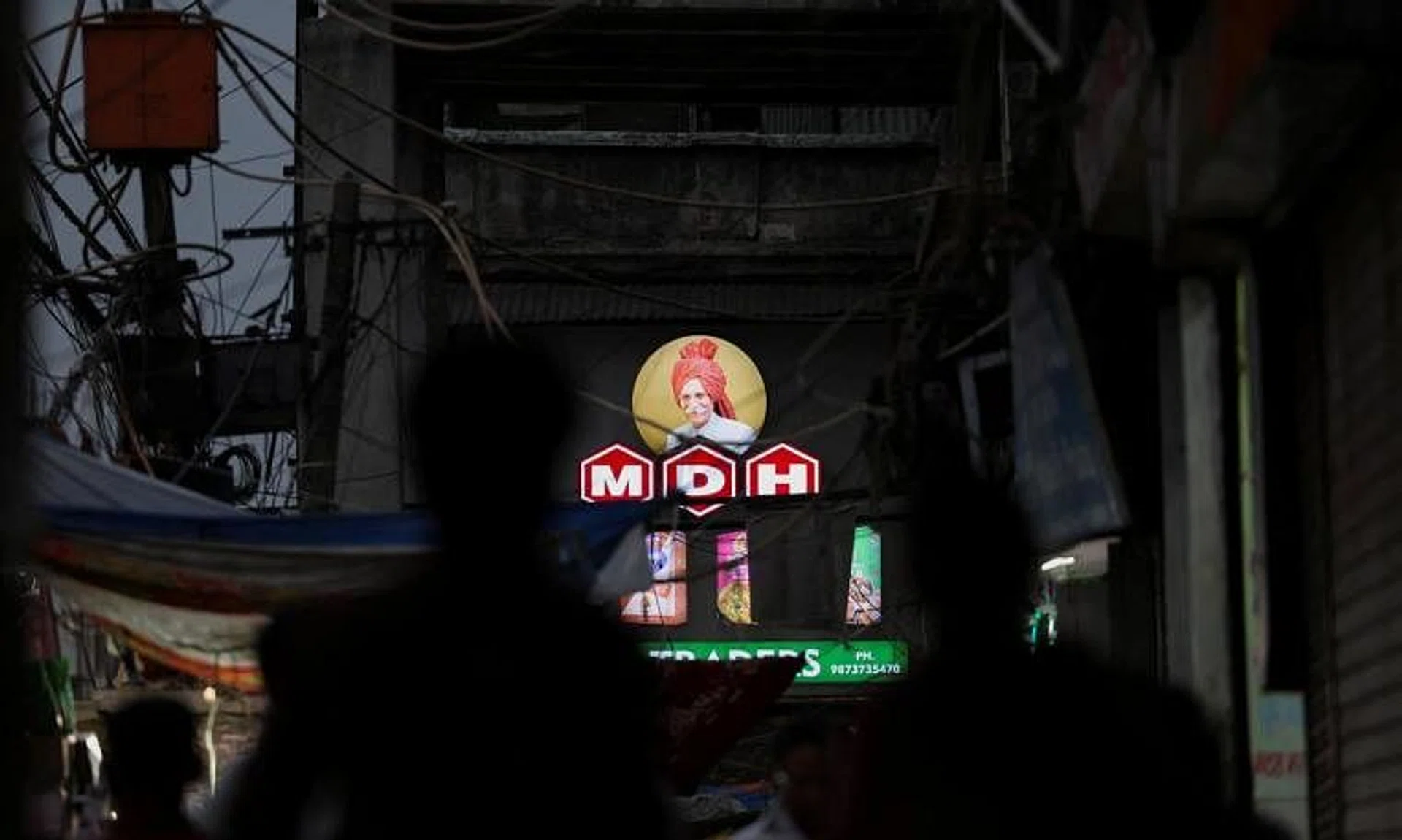 FILE PHOTO: A view of the logo of MDH, an Indian spice manufacturing company, on a shop in the old quarters of Delhi, India, May 3, 2024. REUTERS/Anushree Fadnavis/File Photo