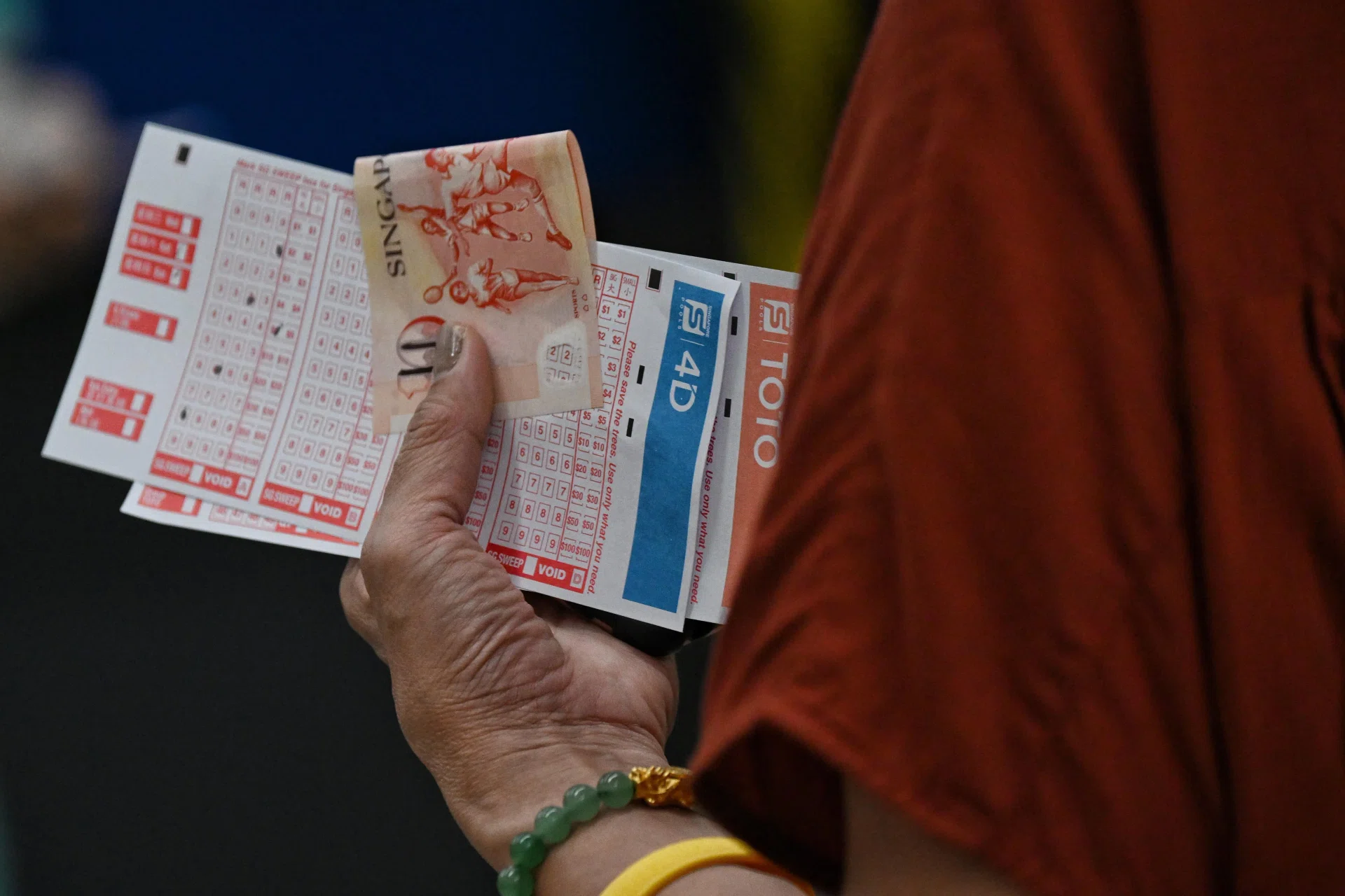 The winning tickets were bought through the Singapore Pools account betting service.