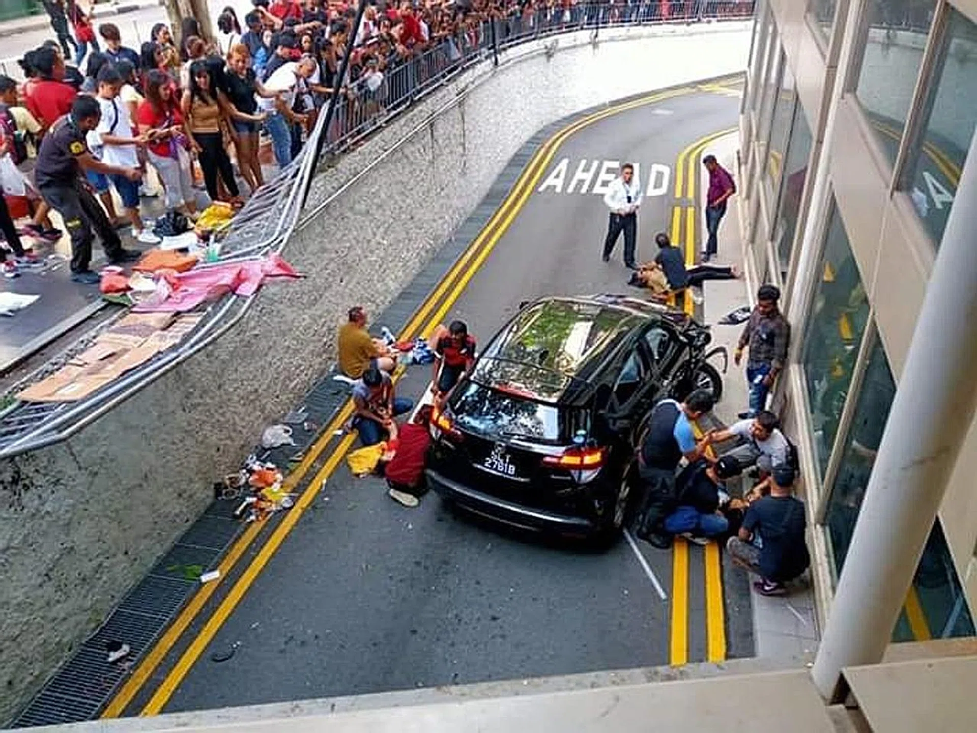 (Above) Passers-by ran over to help the victims.