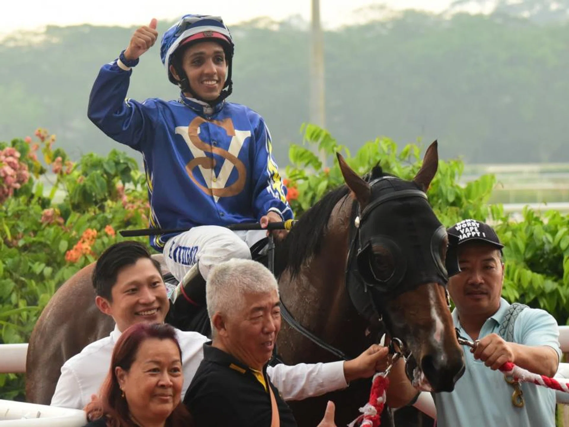 Jason Ong's (white shirt) Akhtar gave Bruno Queiroz his best day in the saddle at Kranji on Oct 21 with a fourth win in the last race.
