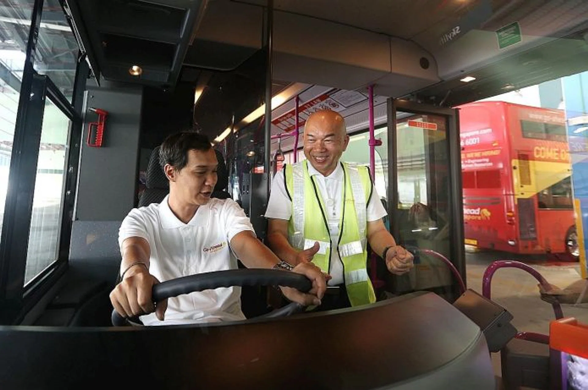 GETTING READY: Bus operator Go-Ahead Singapore staff train in preparation for the bus operator's launch in September. 
