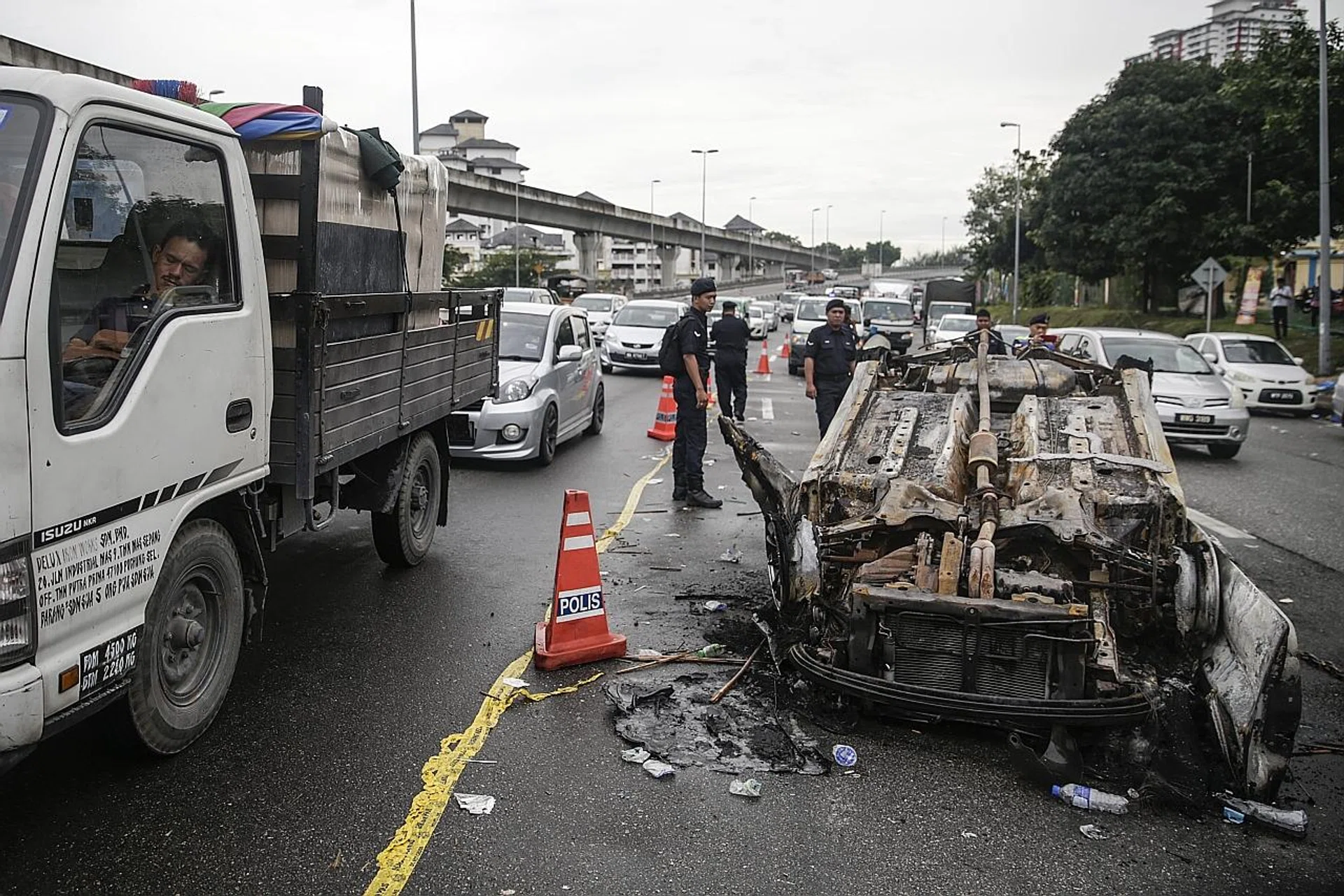 Four men were yesterday charged for riots at the Hindu temple which left many cars torched. 