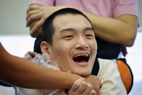 Mr Lucas Oon loves to pull people towards him to give hugs.