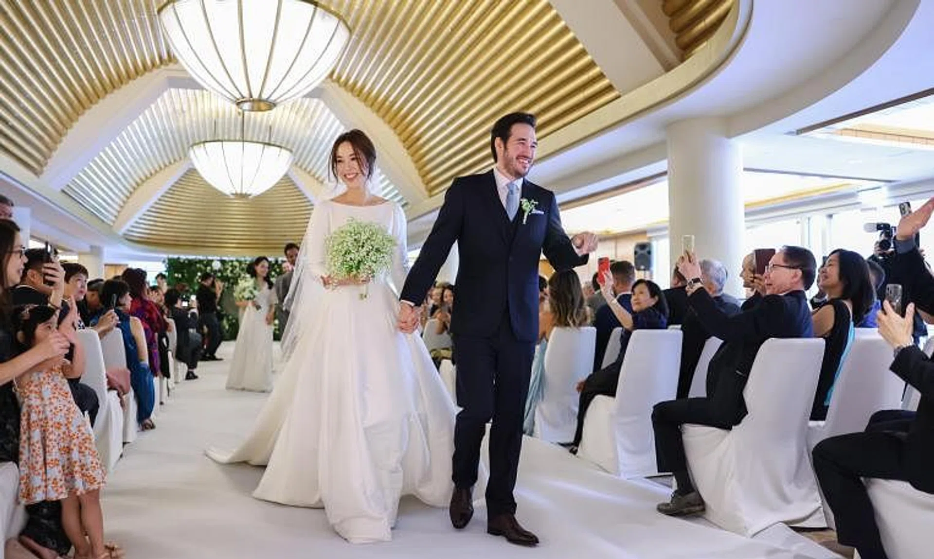 Mediacorp actress Rebecca Lim (left) married Mr Matthew Webster (right) at The Ritz-Carlton, Millenia Singapore on Nov 27, 2022.