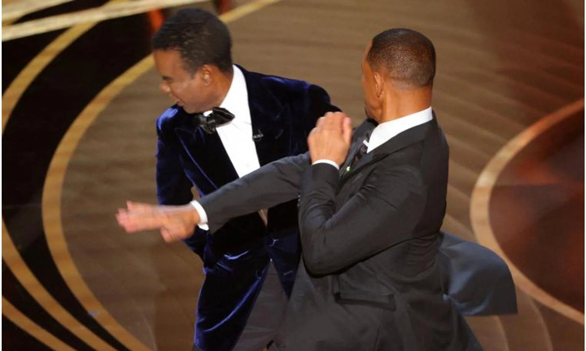 Will Smith hits at Chris Rock on stage during the 94th Academy Awards in Hollywood, Los Angeles, on March 27, 2022. 