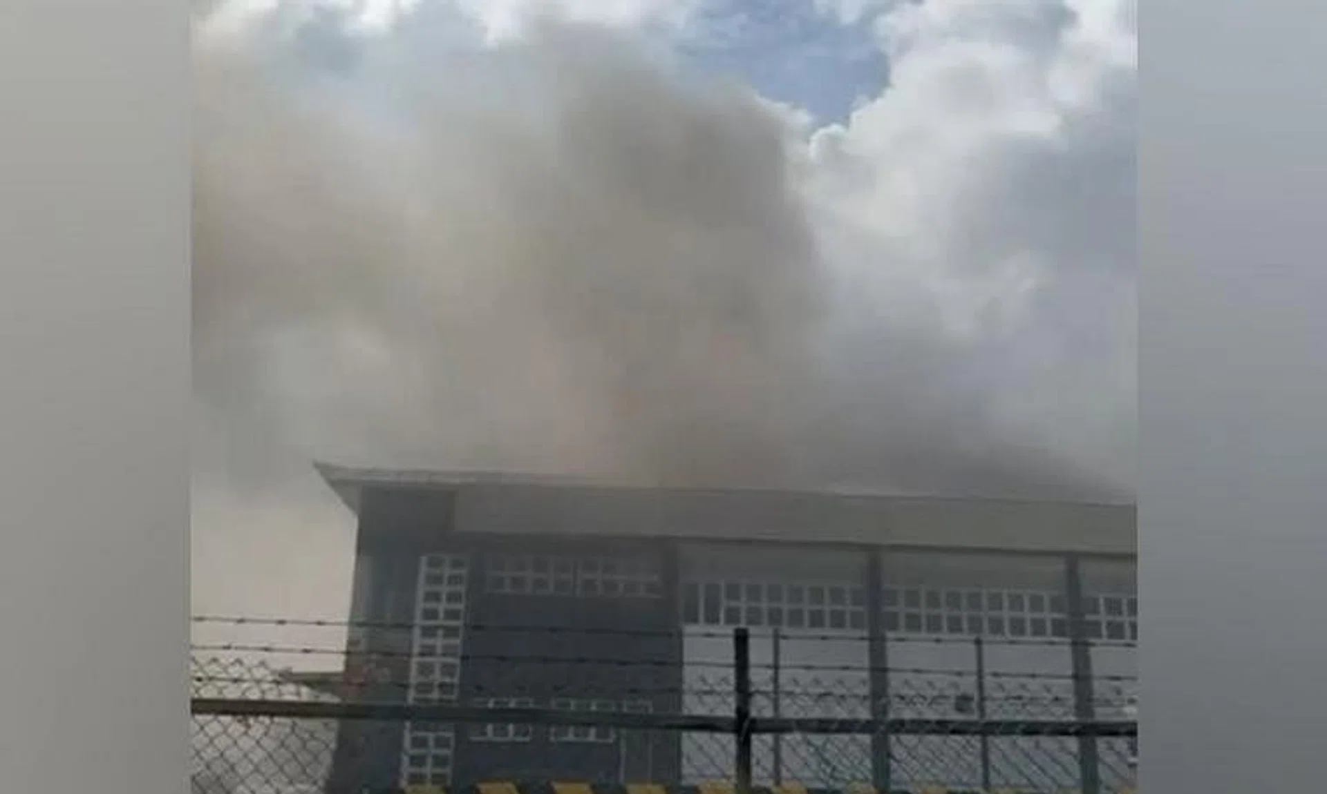 Smoke emitting from the second floor of a two-storey industrial building at Fishery Port Road on June 28.