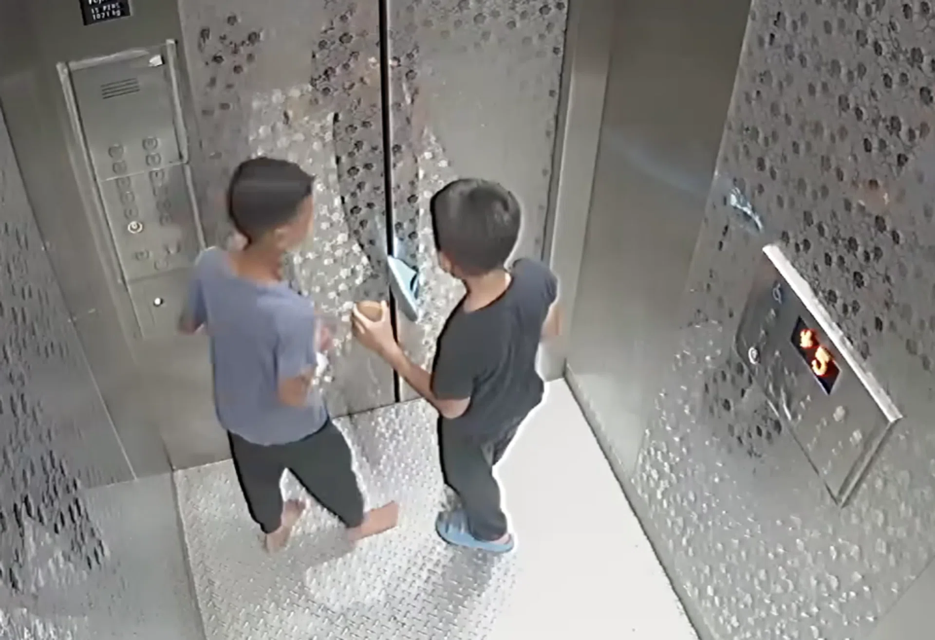 One of the boys stuck his slipper between the lift doors.