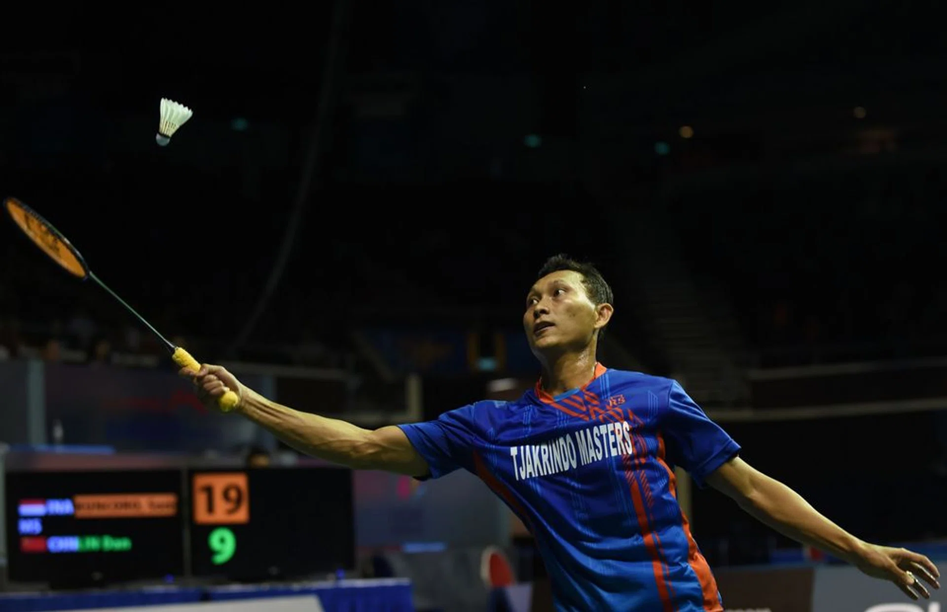 Sony Dwi Kuncoro of Indonesia hits a return shot against Lin Dan of China during their men's singles semi-final badminton match at the Singapore Open in Singapore on April 16, 2016.