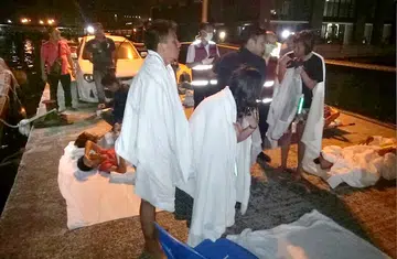 Survivors huddled to stay alive in cold waters