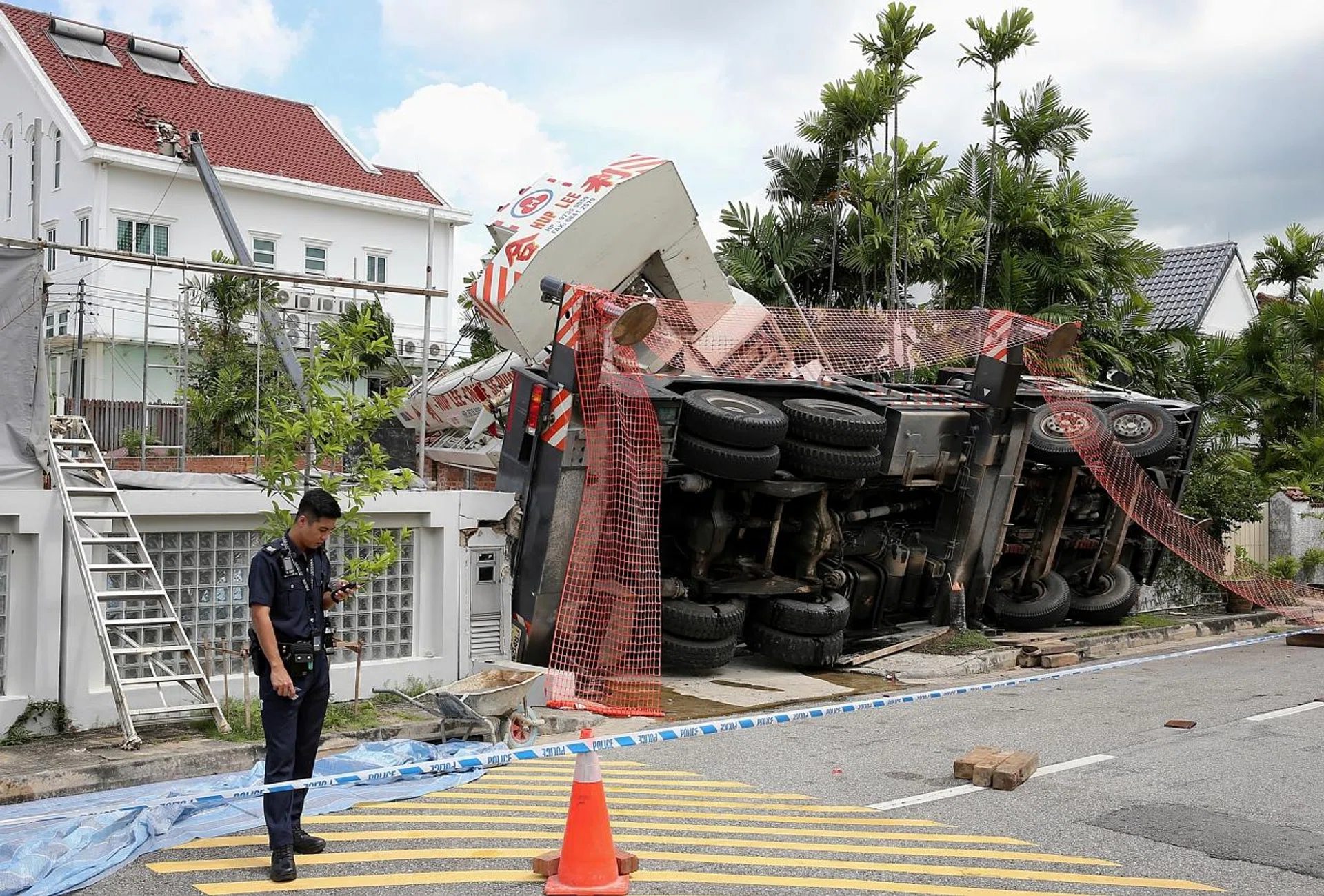A BCA spokesman said a localised portion of the tiled roof of a two-storey detached house at 24 Siglap Avenue and the eaves of the roof of a detached house at 29 Siglap Plain were damaged by the crane boom. 