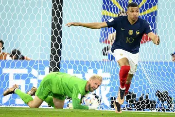 Mbappe double sinks Denmark, takes France into last 16