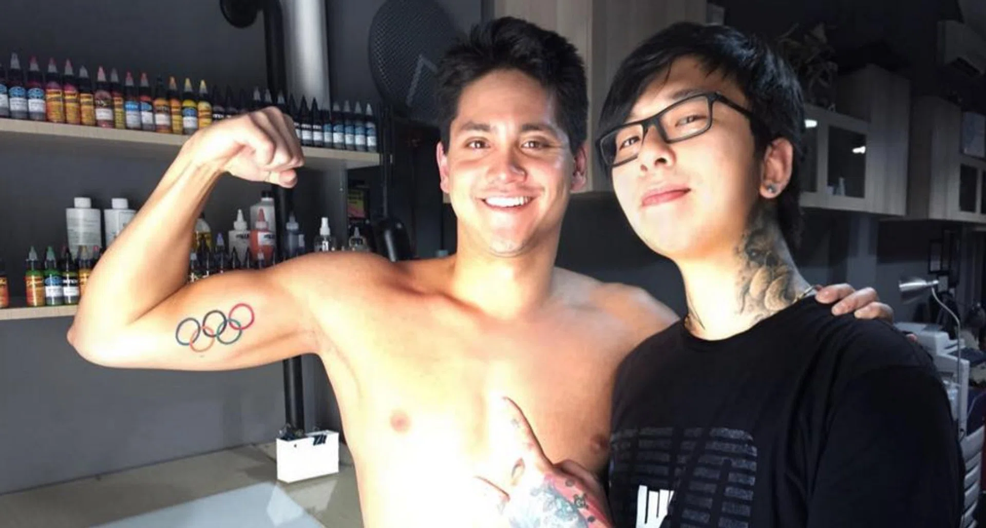 Joseph Schooling (left) and tattoo artist Kelvin Leow. 