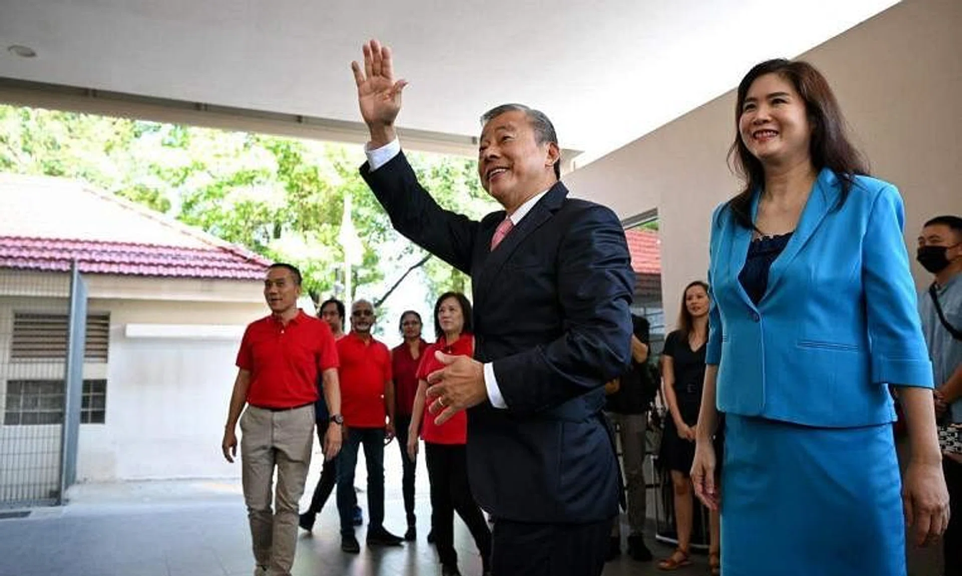 Mr George Goh (with his wife Lysa Sumali) said his team advised him that the "stable of companies which he manages, taken together, would enable him to qualify".