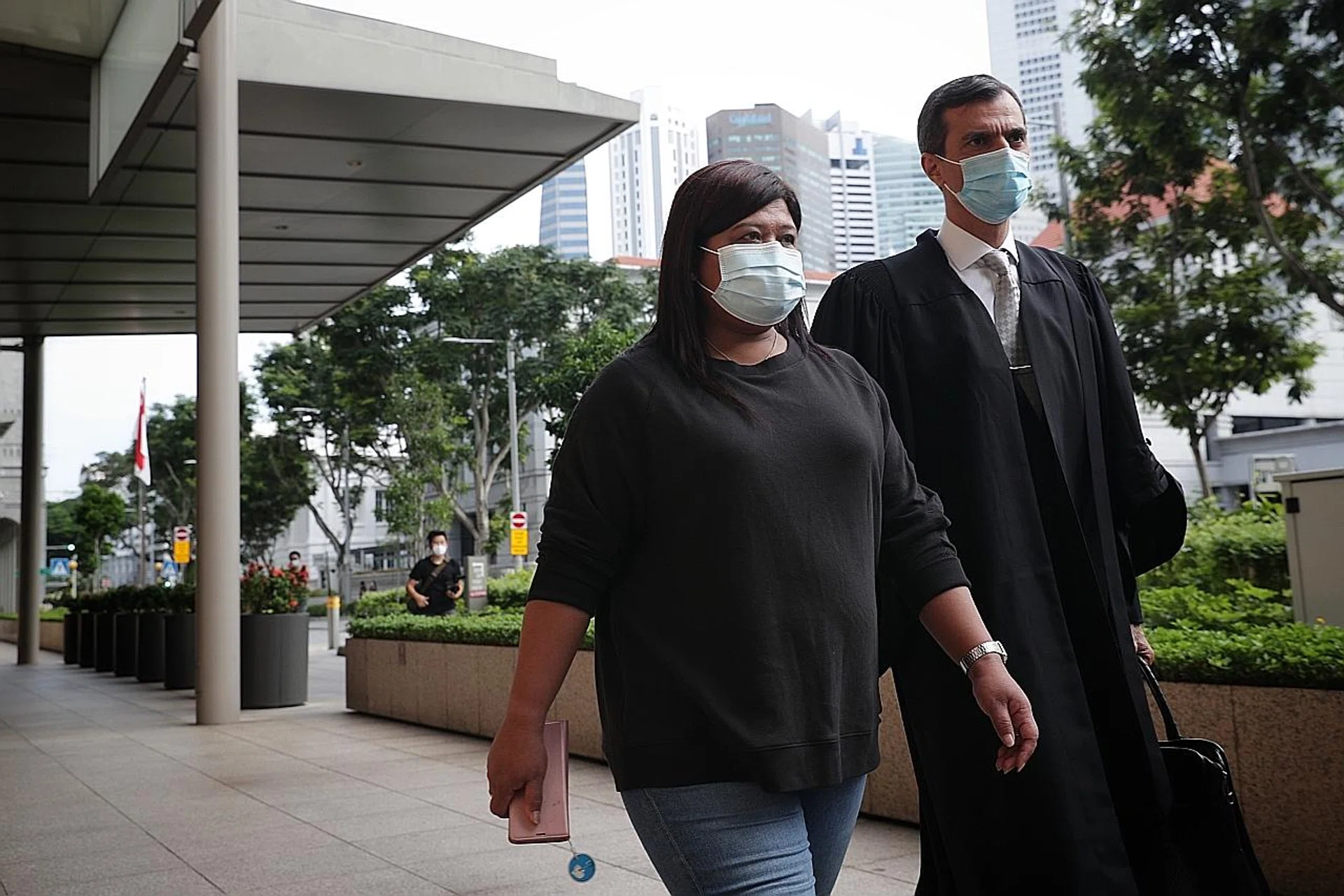 Ms Parti Liyani and Mr Anil Balchandani leaving the Supreme Court yesterday. Mr Balchandani said Ms Parti had initially considered seeking compensation from the Liews but later changed her mind. 