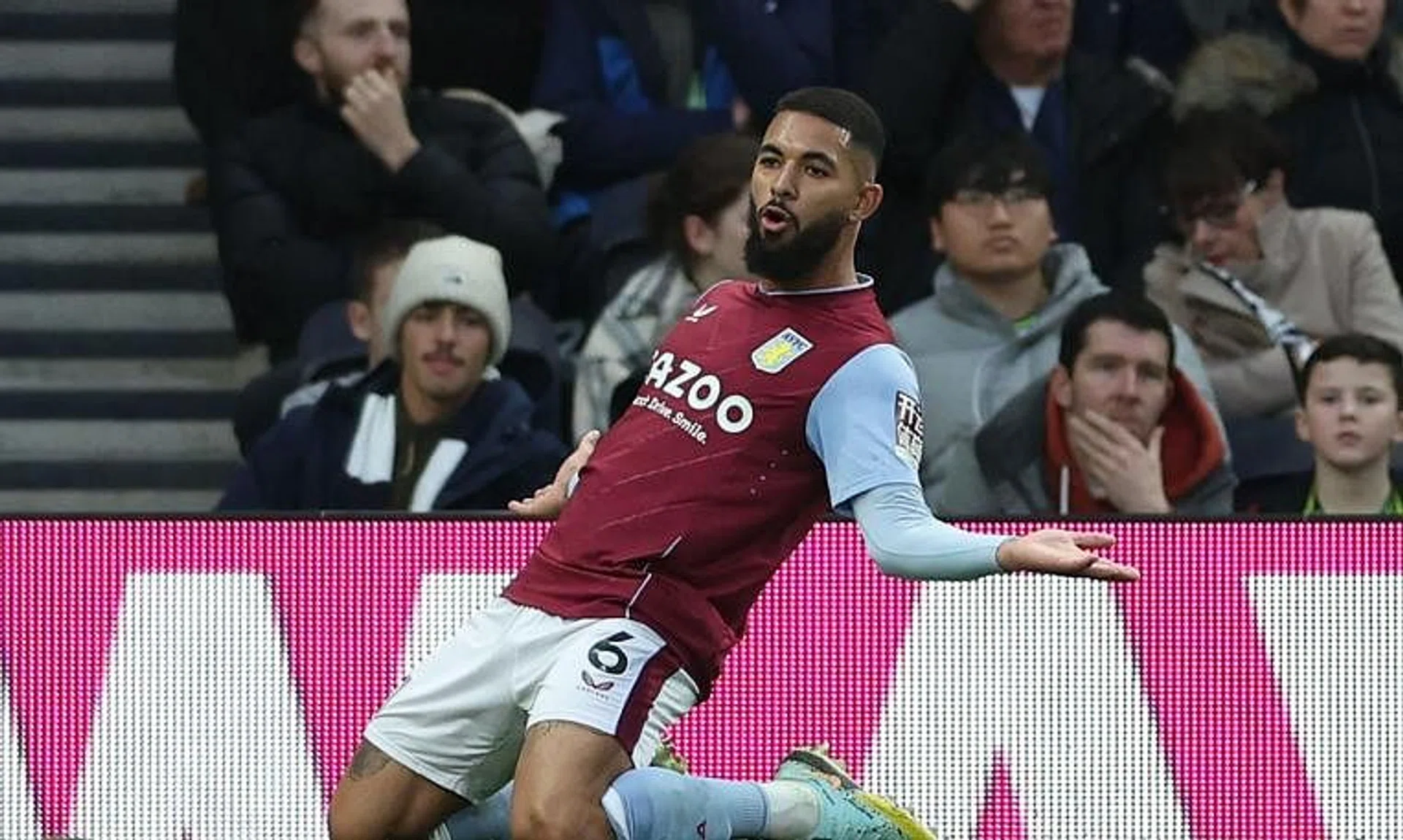 Aston Villa's Brazilian midfielder Douglas Luiz celebrating after scoring their second goal.