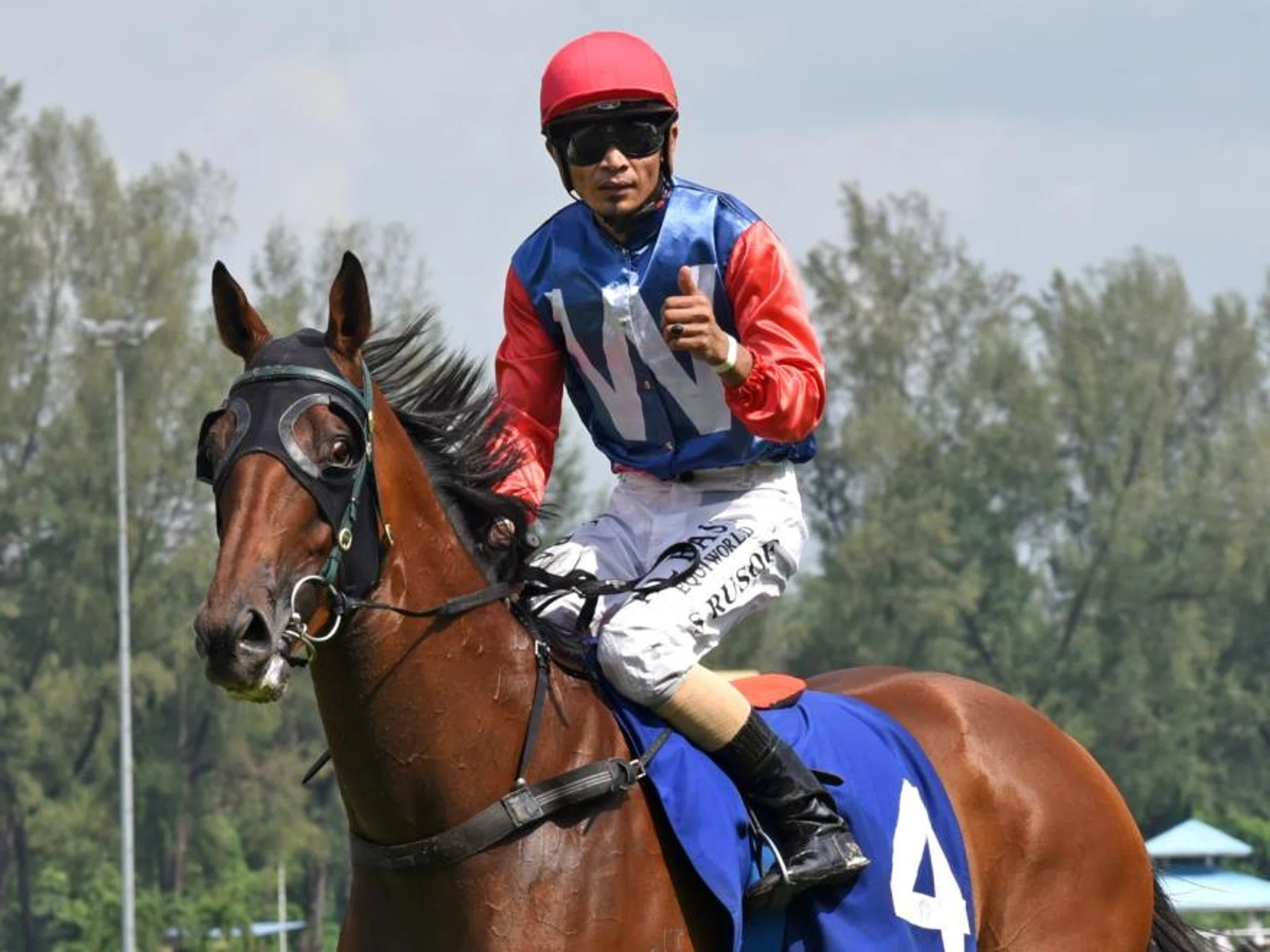 Jockey Shafiq Rizuan bringing Witnessimpact back to scales after his win in the Power Toto 6/55 Stakes (1,100m) on Oct 13.
