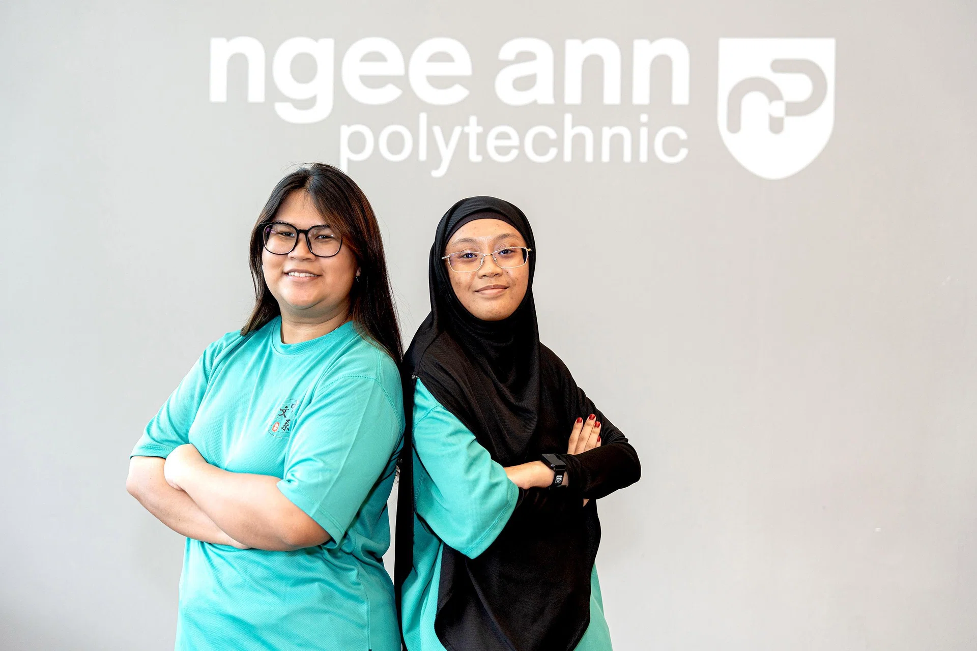 Syakirah Dahiyah Sudanto (right), the first Malay student to enrol in Ngee Ann Polytechnic's Chinese Studies, with the diploma course's first Chinese-Indian student Darshnee Abigail Arasu.