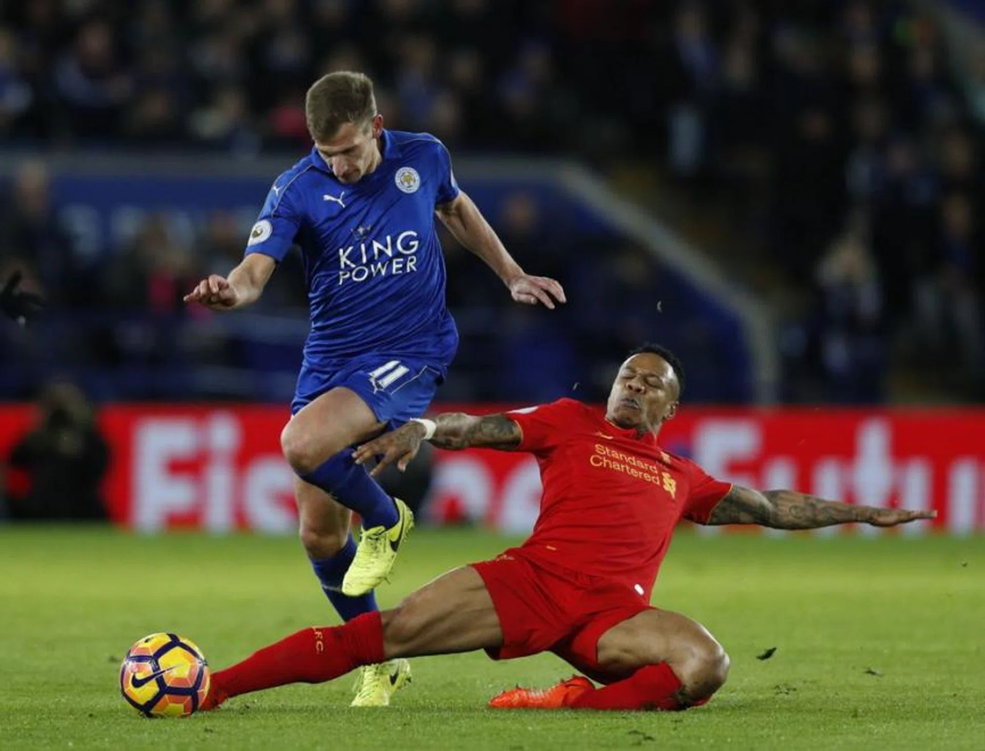 Leicester City's English midfielder Marc Albrighton (L) vies with Liverpool's English defender Nathaniel Clyne during the English Premier League football match between Leicester City and Liverpool at King Power Stadium in Leicester, central England on February 27, 2017.