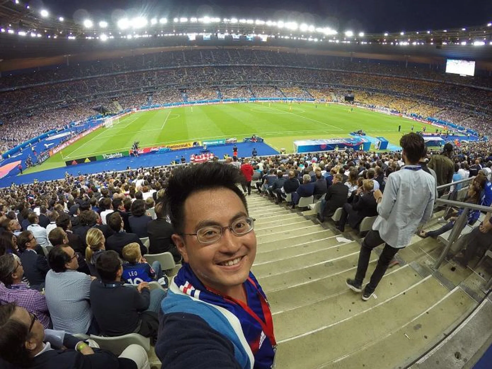 LUCKY: Mr Ko Chong Tat at the Germany-Ukraine football match (above), the Formula 1 race in Monaco and the French Open men's final.