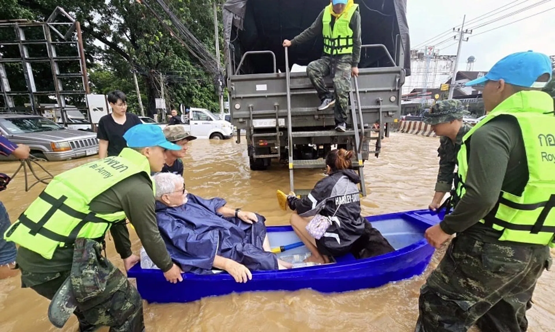 Thai soldiers evacuating residents from their flooded houses in the tourist city of Chiang Mai, northern Thailand, on Sept 26.