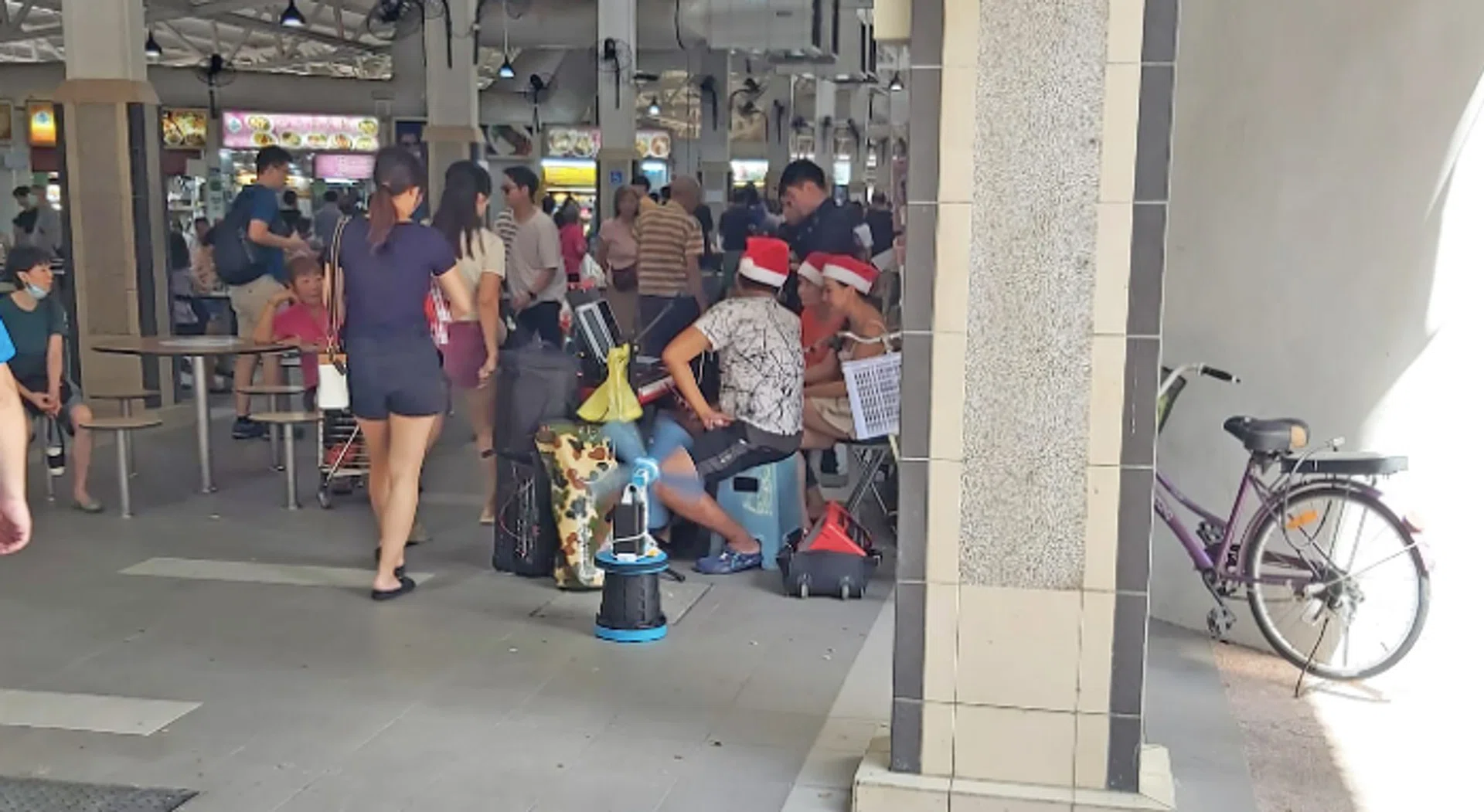 The buskers at the busy Ang Mo Kio Central Market & Food Centre.