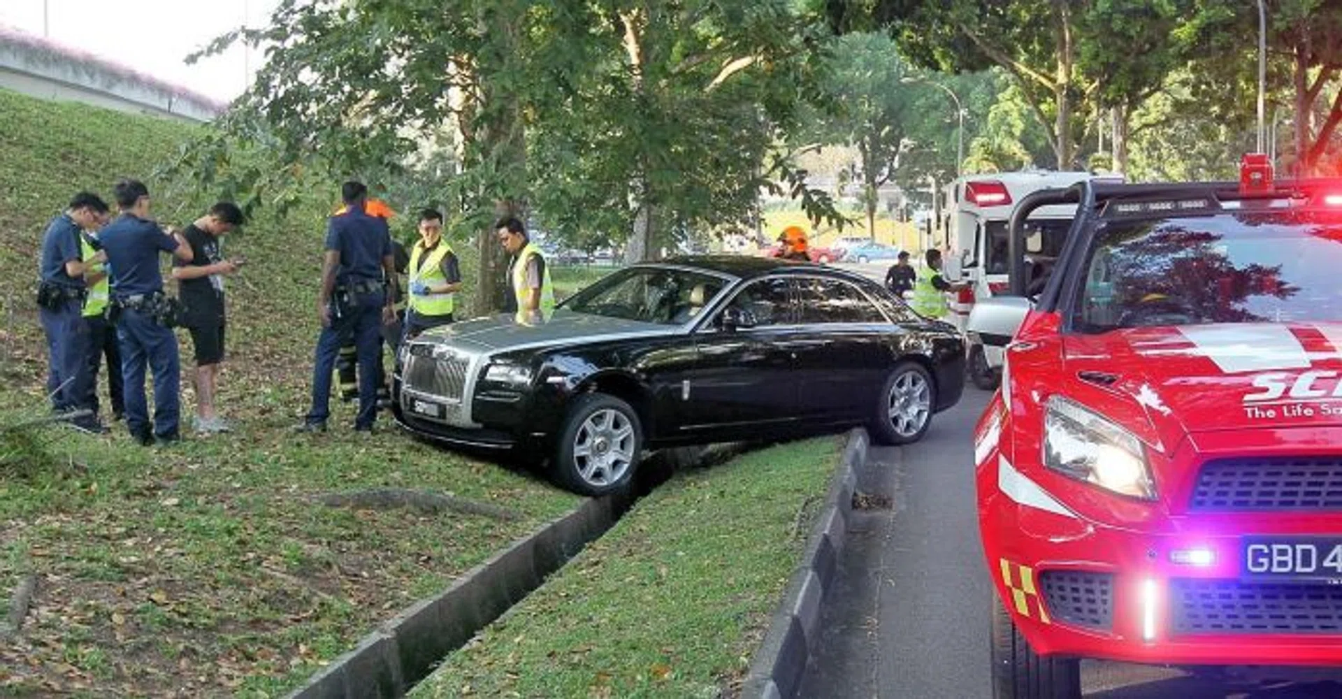 ARRESTED: The Rolls-Royce Ghost driver, whom passers-by saw slumped in his seat, was arrested after failing a breathalyser test.
