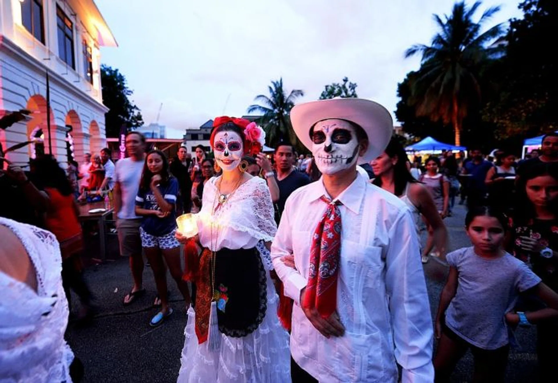HONOURING THE DEAD: Dia de los Muertos Singapore honoured some celebrities who died this year, such as singers David Bowie and Prince, with an altar dedicated to them (above). 
