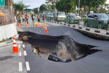 Car plunges into sinkhole on Tanjong Katong Road; one taken to hospital