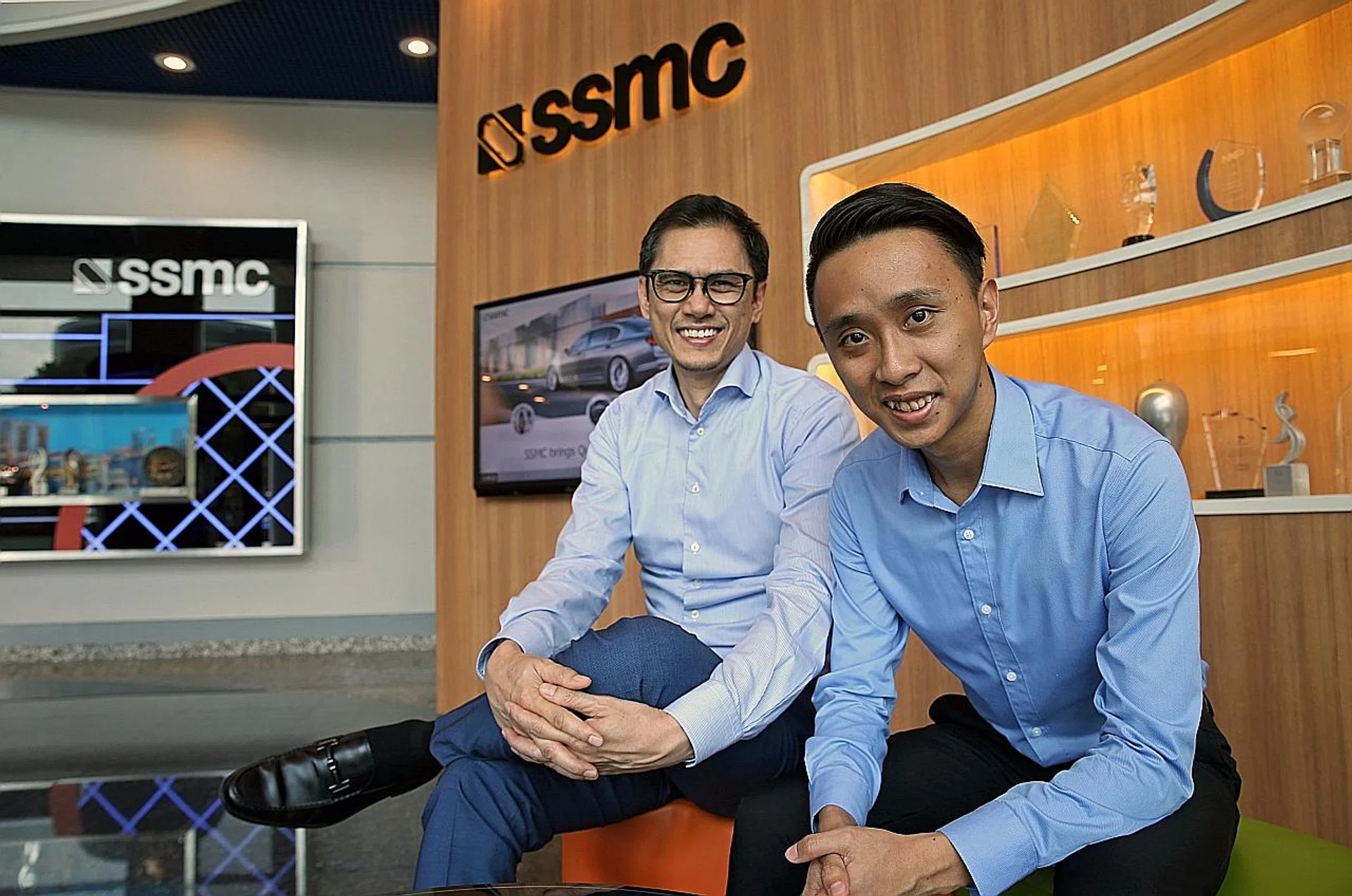 (From left) SSMC human resources director Hanif Mohamed and Mr Glen Lim, a final-year business student at NTU. 