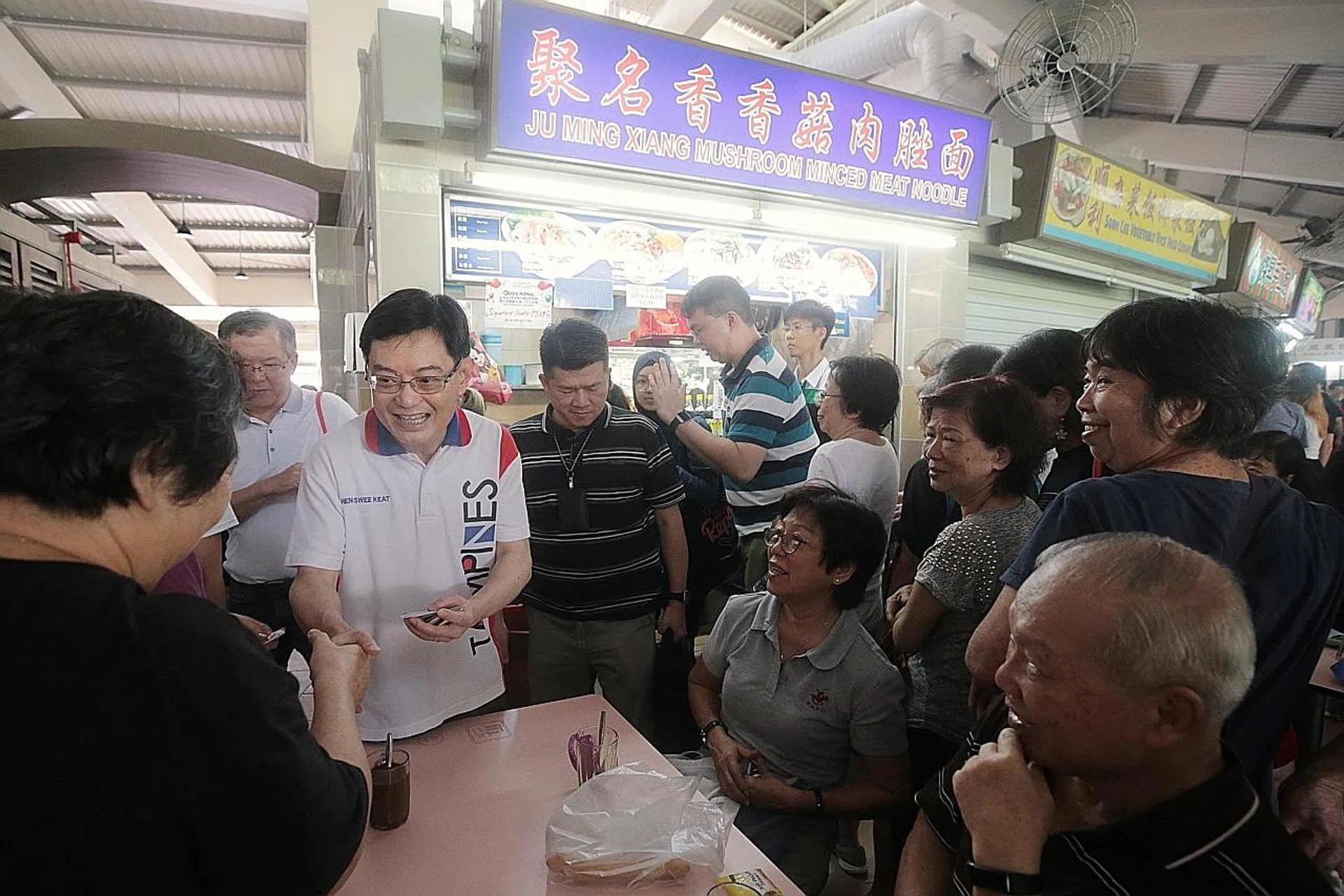 Deputy Prime Minister Heng Swee Keat meets diners at Tampines Round Market and Food Centre. 