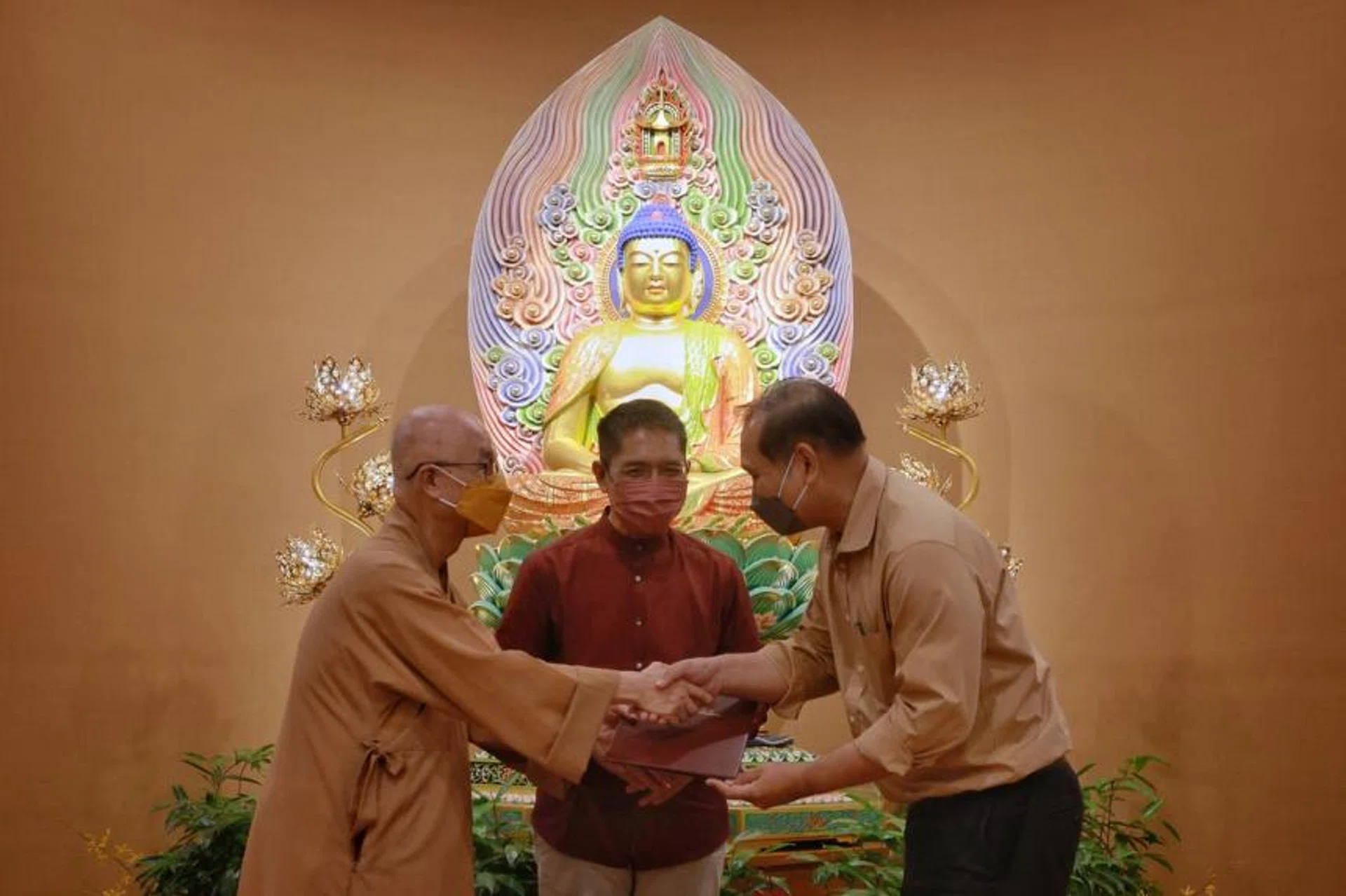 (From left) Singapore Buddhist Federation president Seck Kwang Phing, Minister Maliki Osman and Rahmatan Iil Alamin Foundation CEO Muhd Faizal Othman on May 1, 2022.
