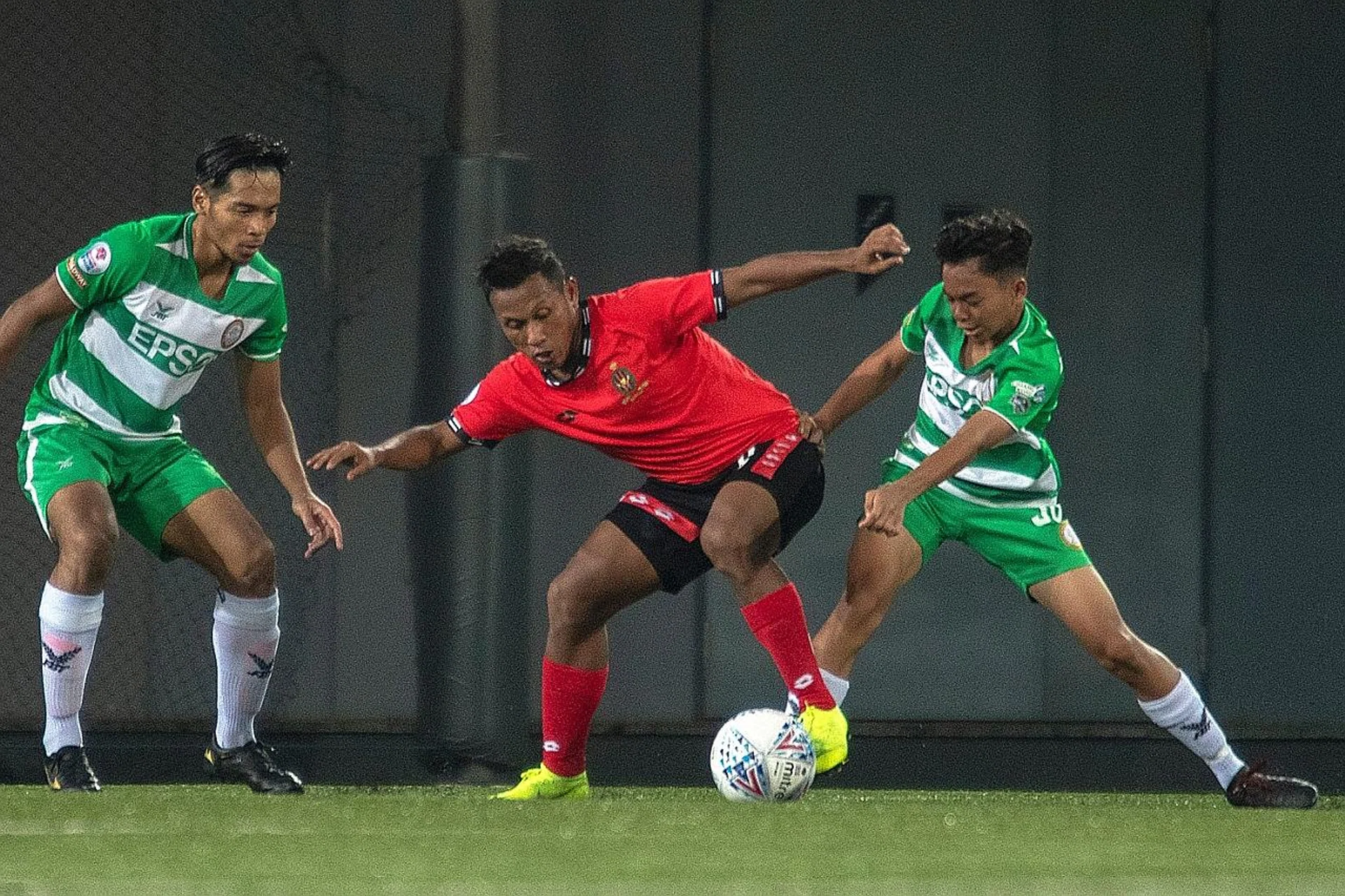 At just 1.60m, Geylang International's Azri Suhaili (in green) was the shortest player on the pitch against Brunei DPMM, but the 16-year-old held his own and played the full match two weeks ago. 