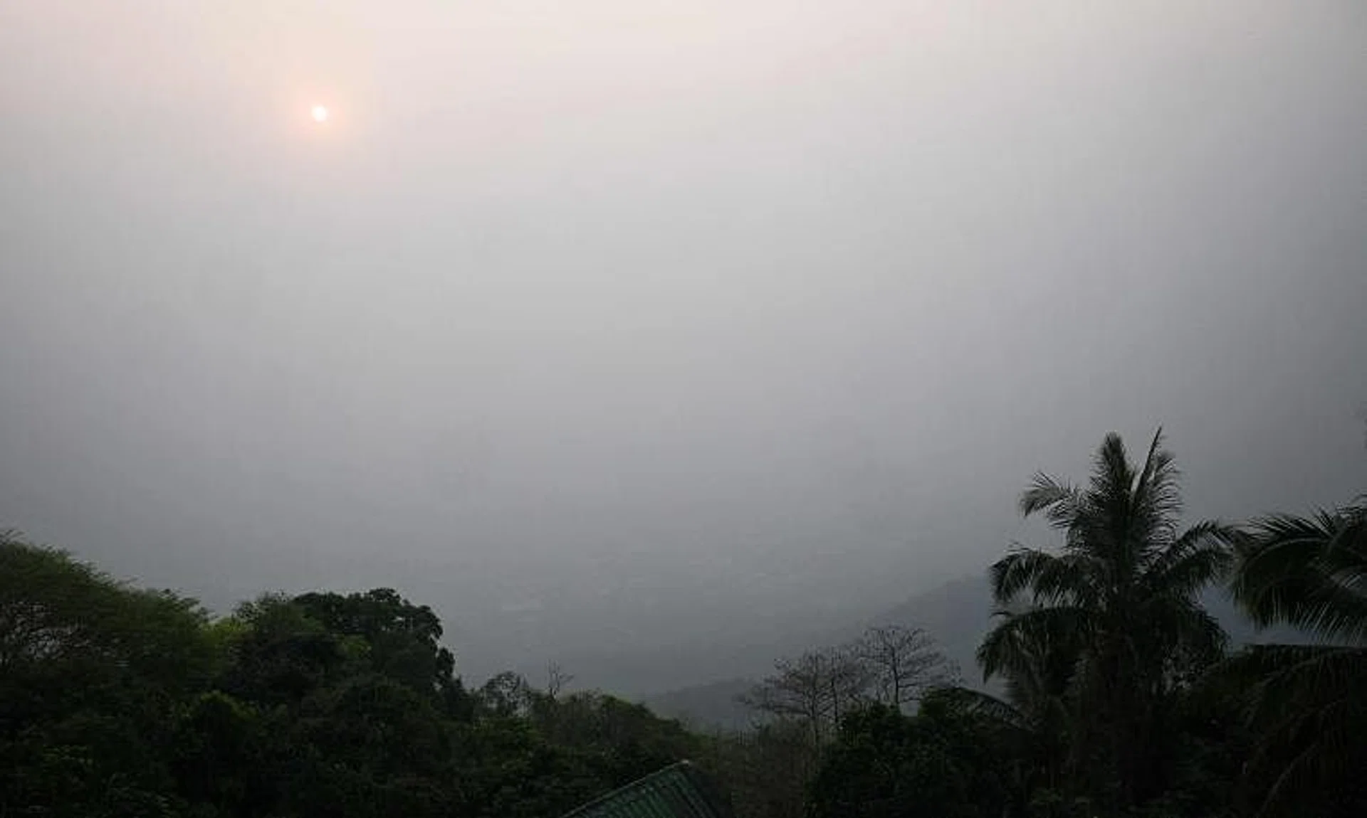 High levels of air pollution obscure the view of Chiang Mai from atop Wat Phra That Doi Suthep temple on March 15.