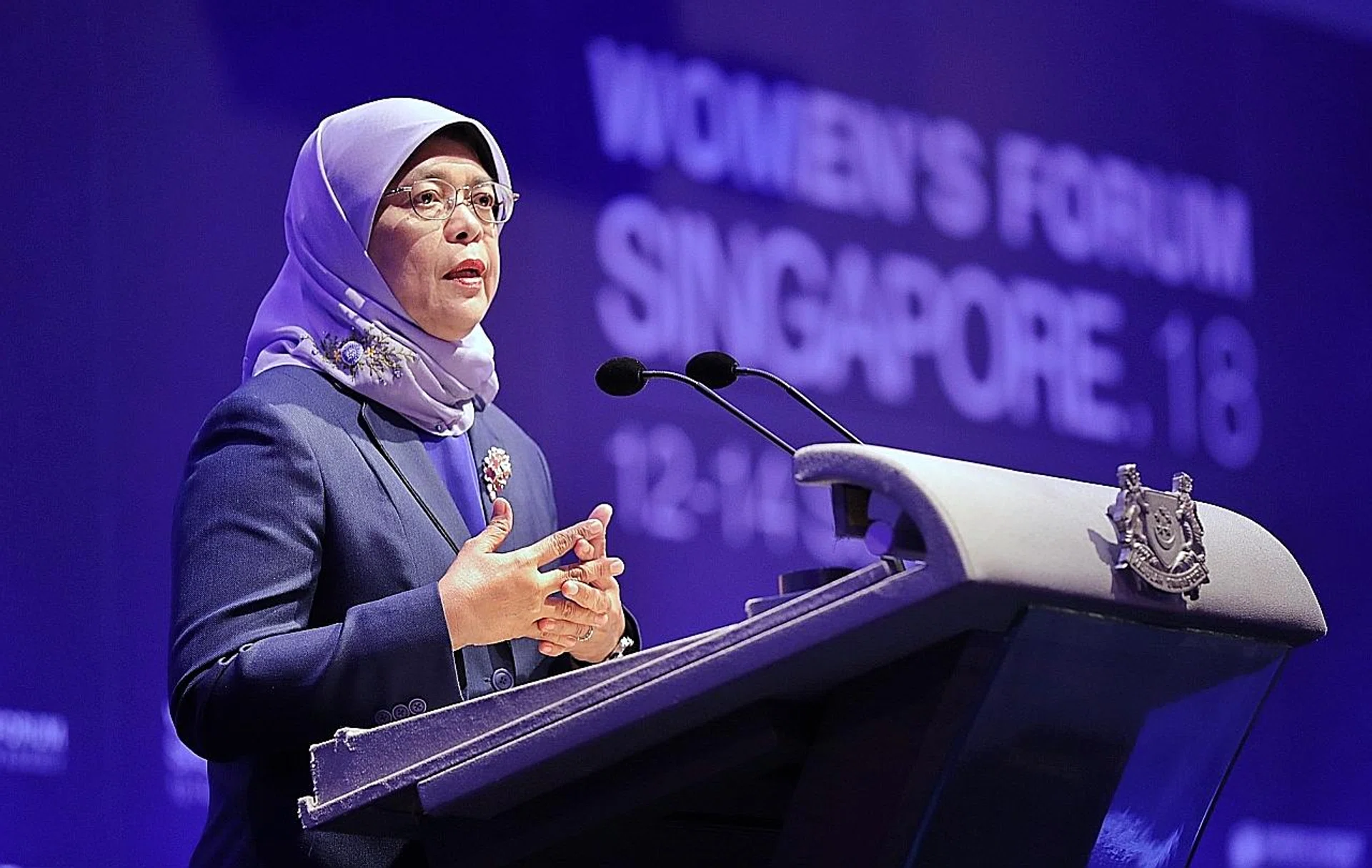 President Halimah Yacob speaking at the opening of the Women's Forum Singapore at the Raffles City Convention Centre yesterday. 