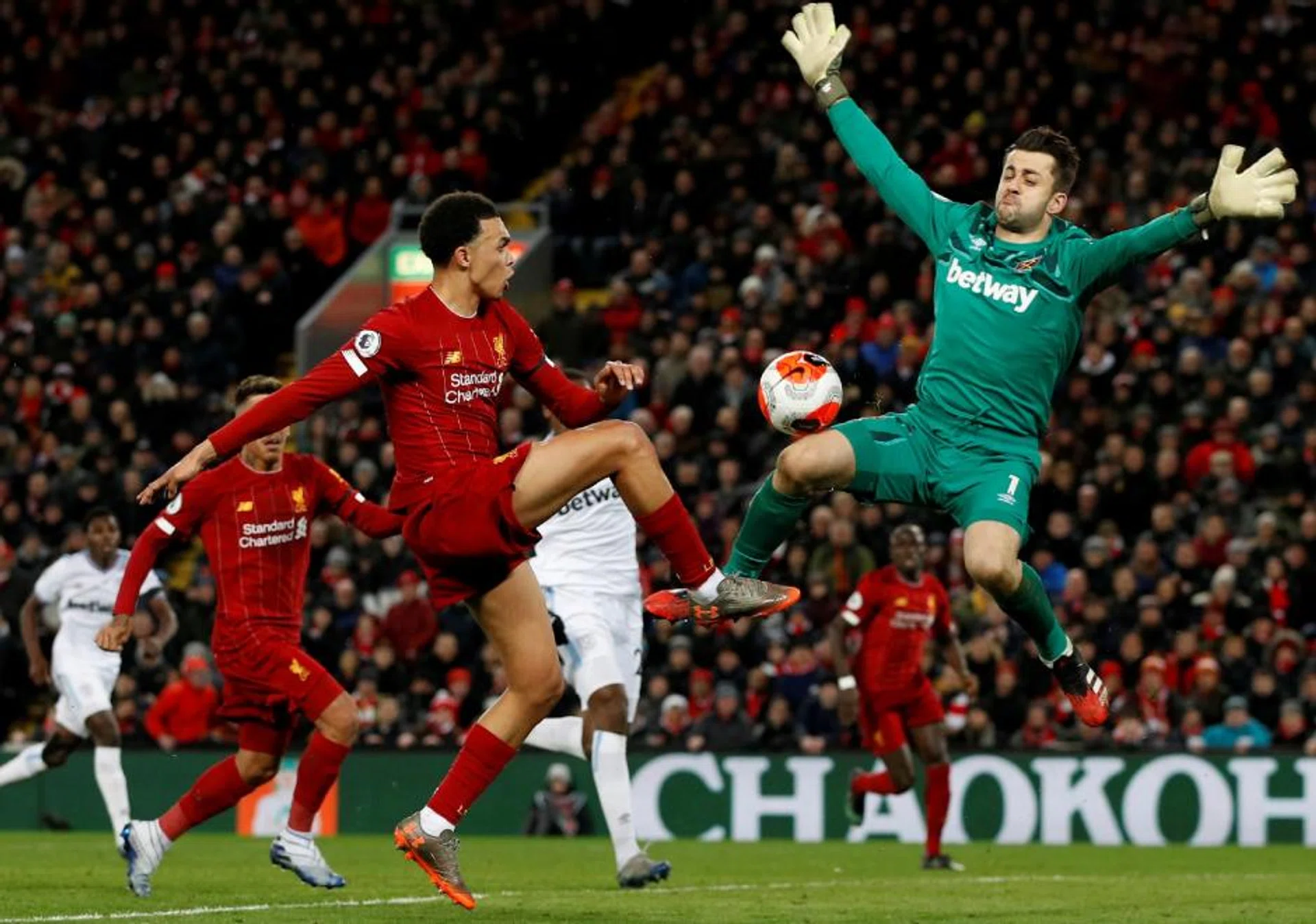 Trent Alexander-Arnold’s Liverpool (in red) are just two wins away from claiming their first English title in 30 years.