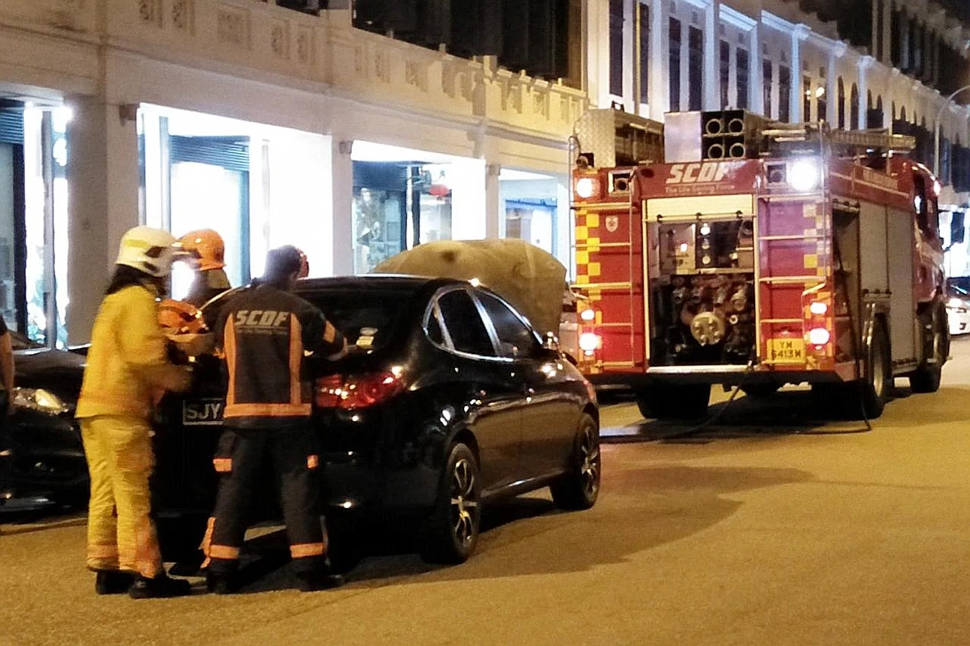 Cars caught fire in Tan Quee Lan Street (above) and Hougang. 