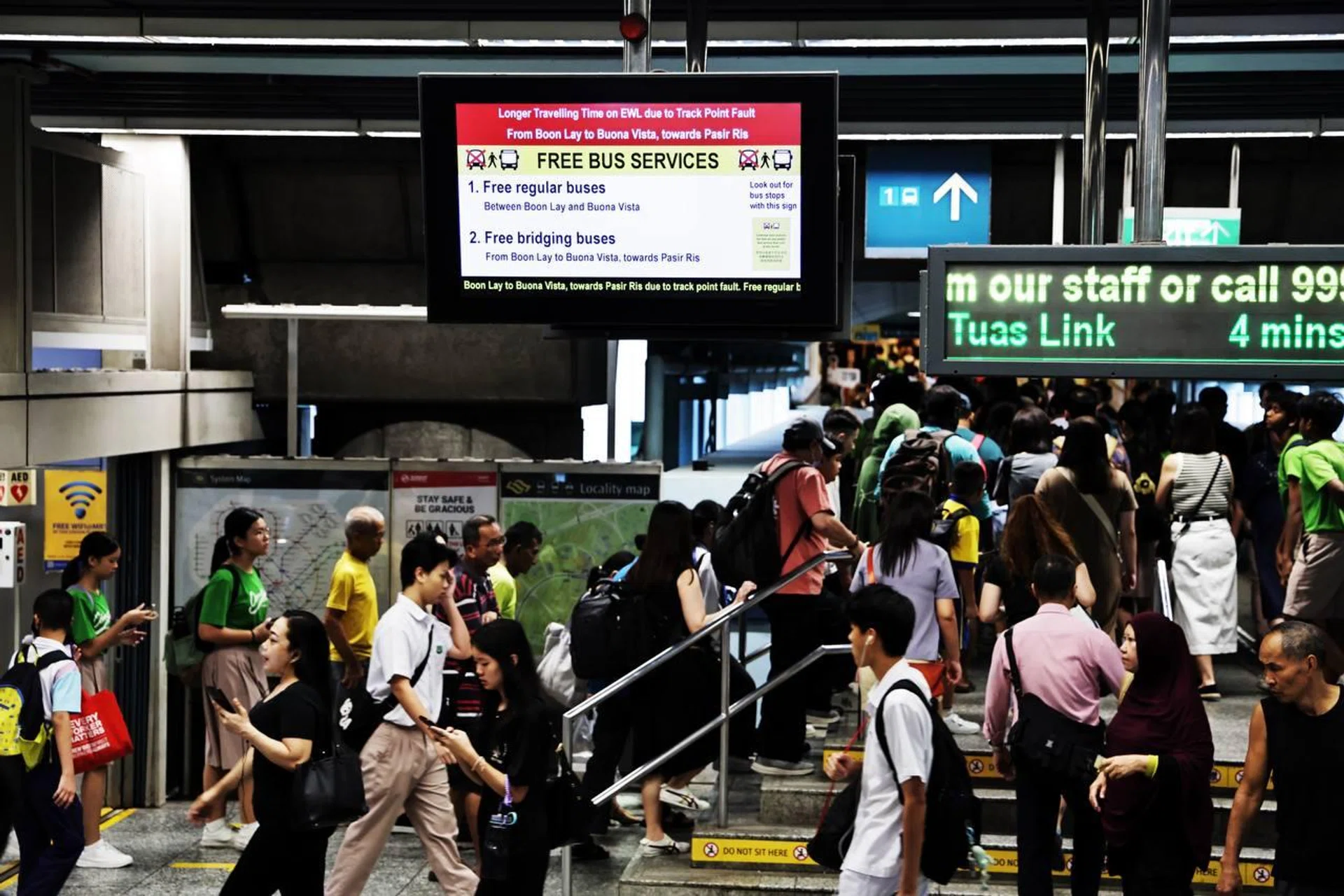 A large crowd of commuters seen at Clementi MRT station at about 7.25am on Aug 6, after a track point fault was reported.