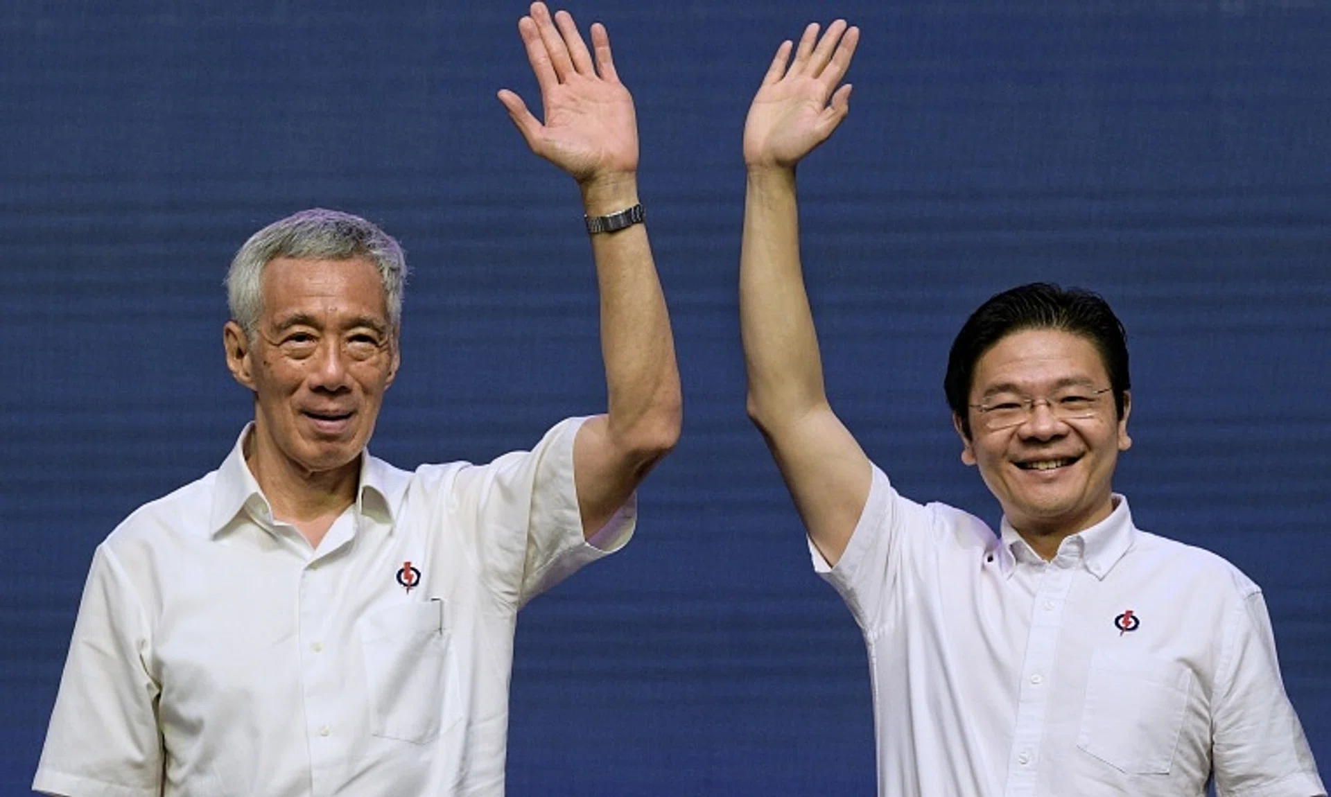 SM Lee Hsien Loong (left) is likely to step down from the PAP's top post of secretary-general, setting the stage for PM Lawrence Wong to become party leader.