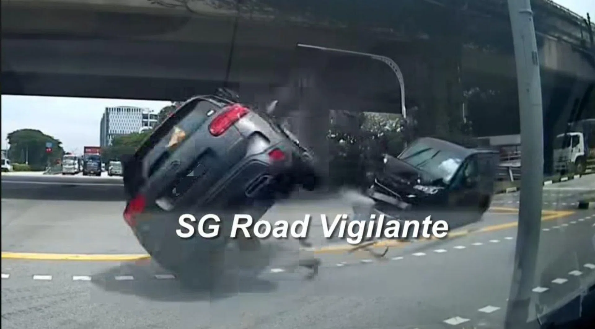 The impact sends the second car spinning and tipping over on its left, with the first car also nearly falling on its side.