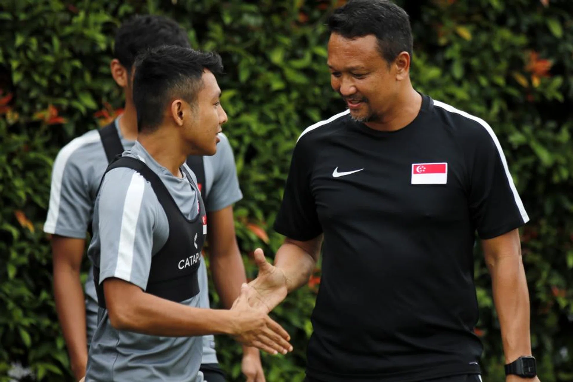 Fandi Ahmad (right, with Zulfadhmi Suzliman) says tonight's result is important, but he also wants to build the team.  