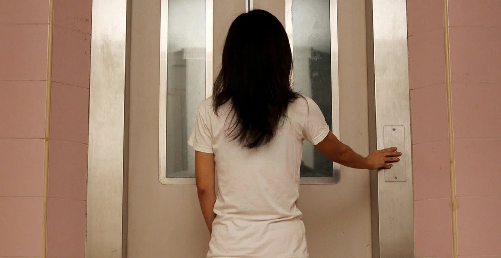 Ms Evi Lisnawati, 36, was stuck in the lift for 90 minutes before she was rescued.