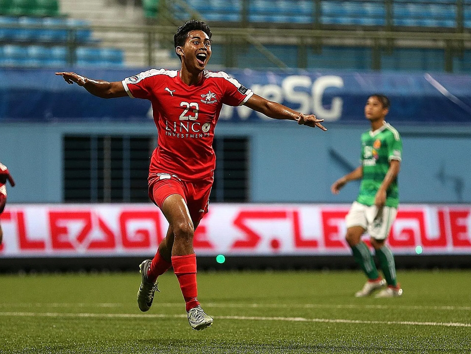 Home United midfielder Adam Swandi celebrates after scoring the first goal in the 14th minute. 