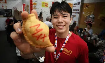 Fans turn out to buy curry puffs from Max Maeder