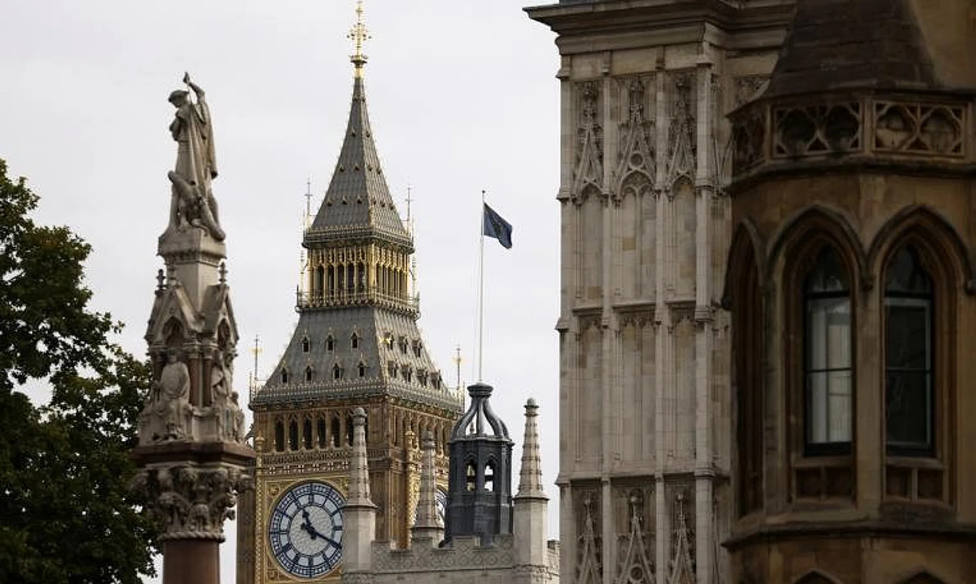 A flag flutters at full mast over Westminster Abbey in London on Sept 20, 2022.