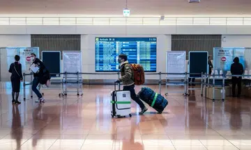 Japan eases entry ban with limited reopening