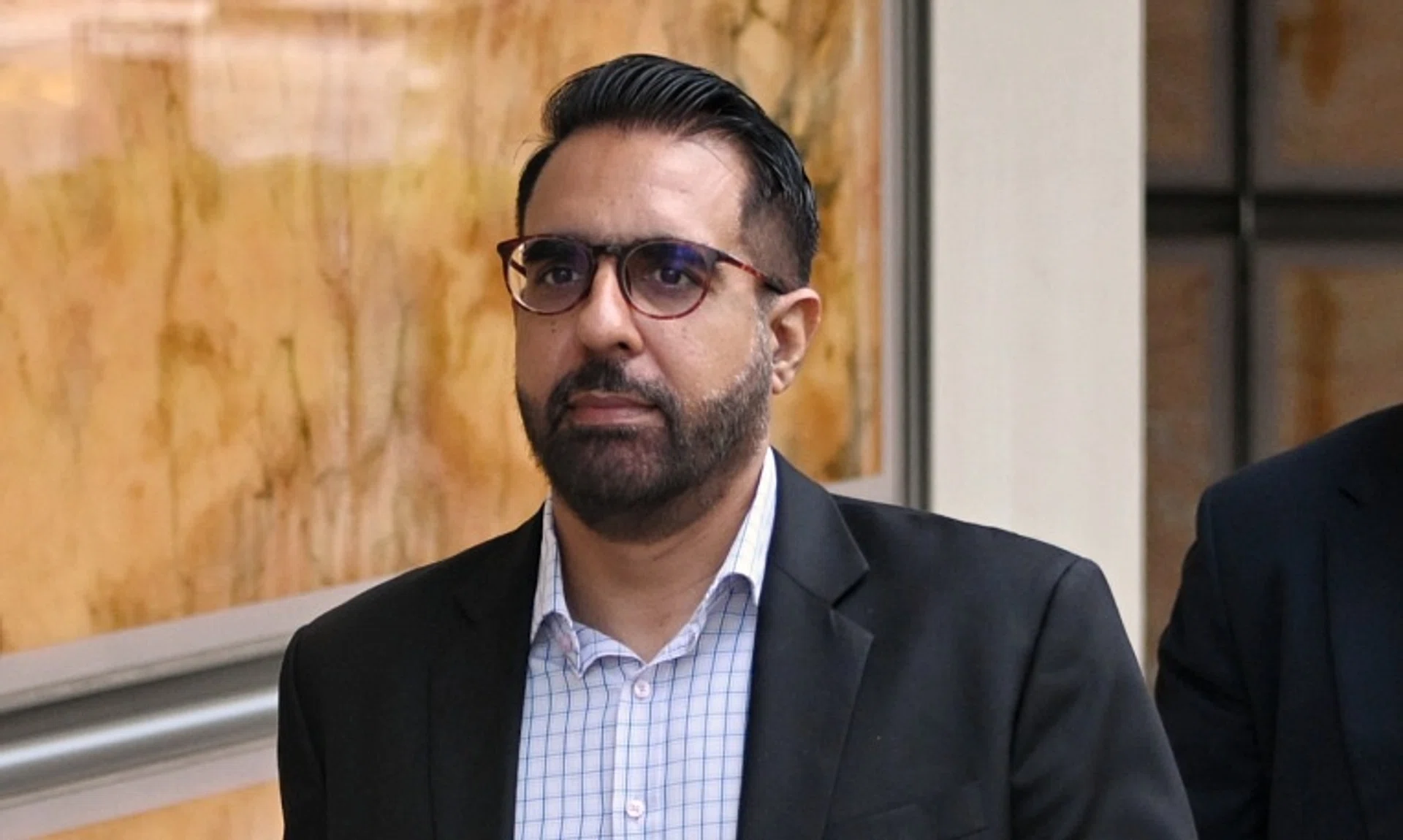 Leader of the Opposition Pritam Singh leaving the Supreme Court on Sept 9 after the result of his application for a High Court trial.