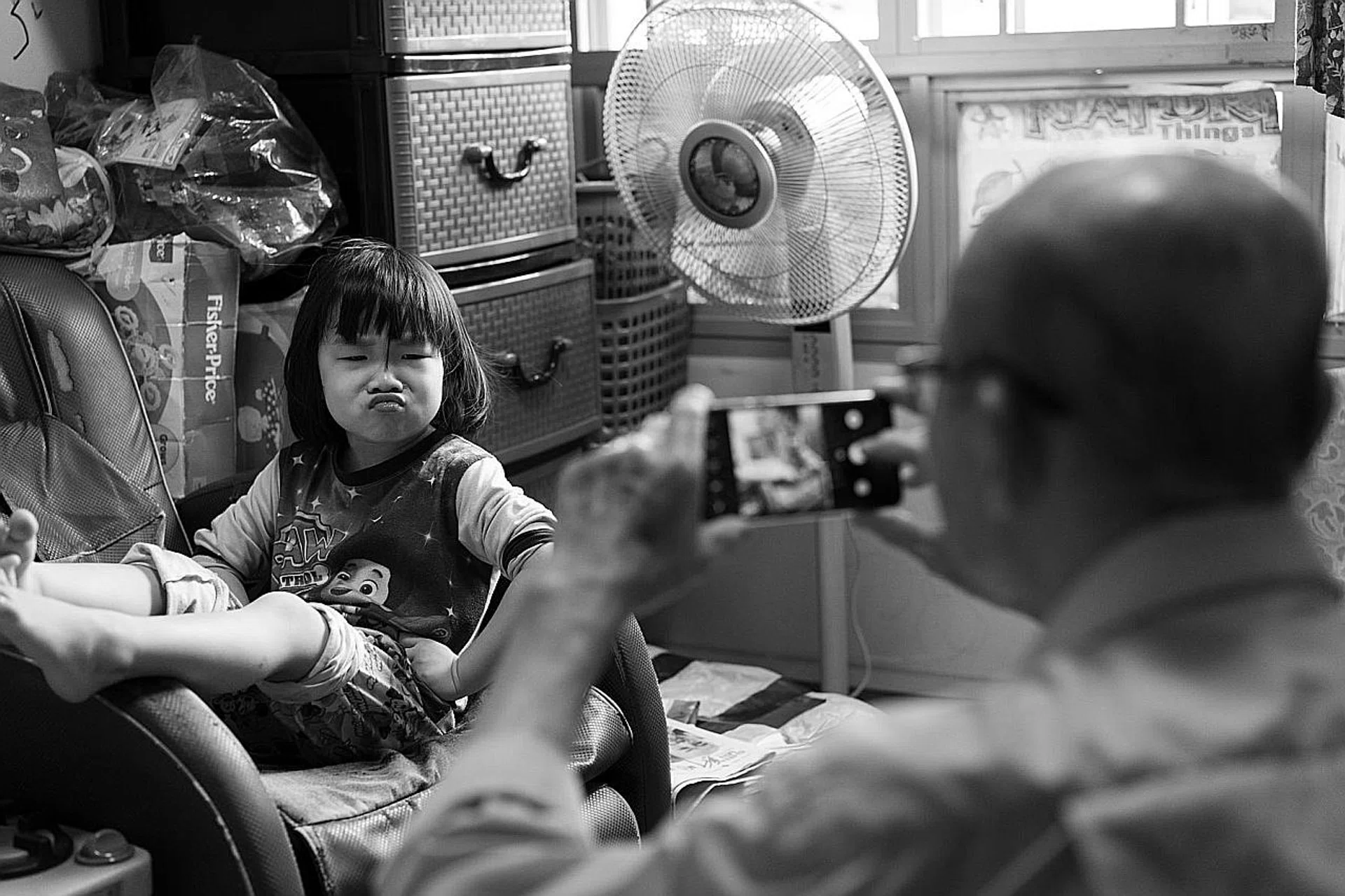 Mr Tan Chin Hock took photos of his parents and daughters bonding during the circuit breaker (above). 