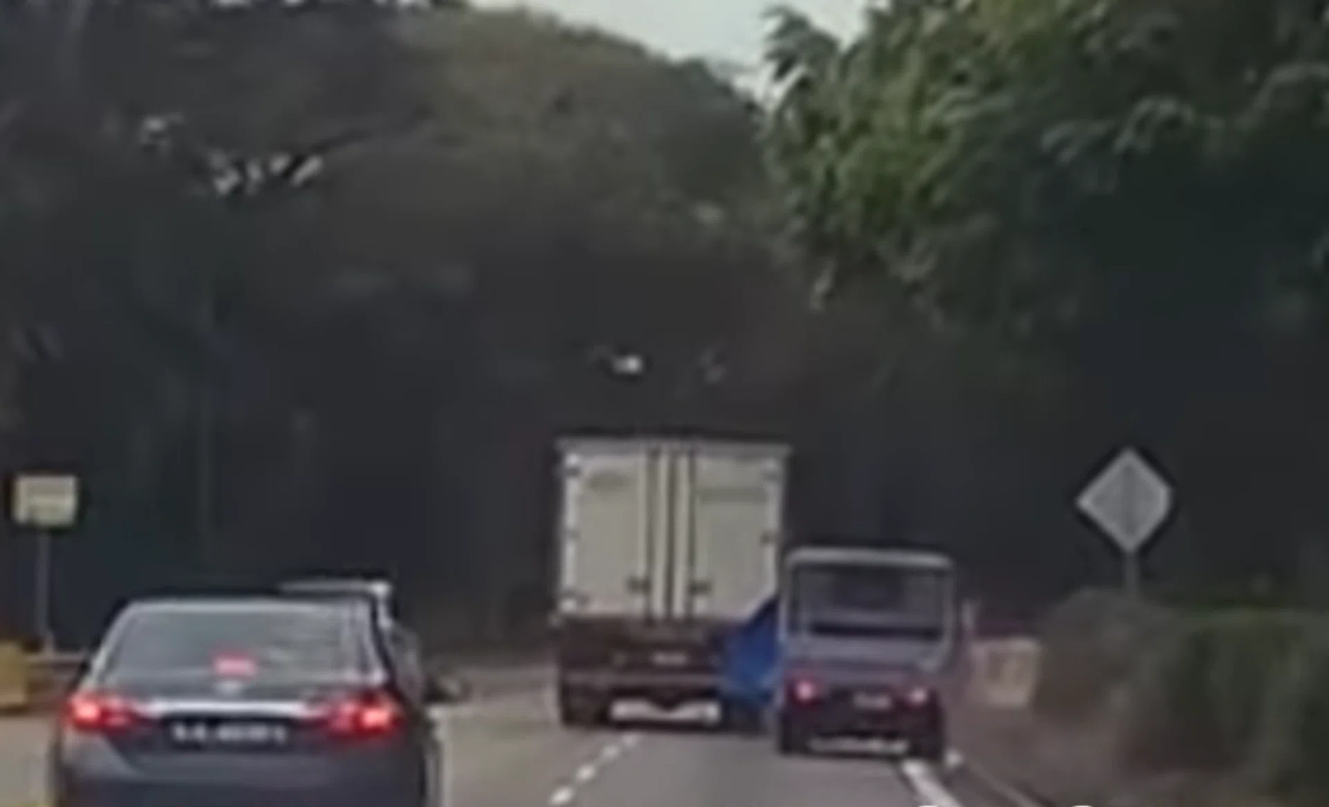 The truck turns to hit the pickup before continuing in the centre lane.