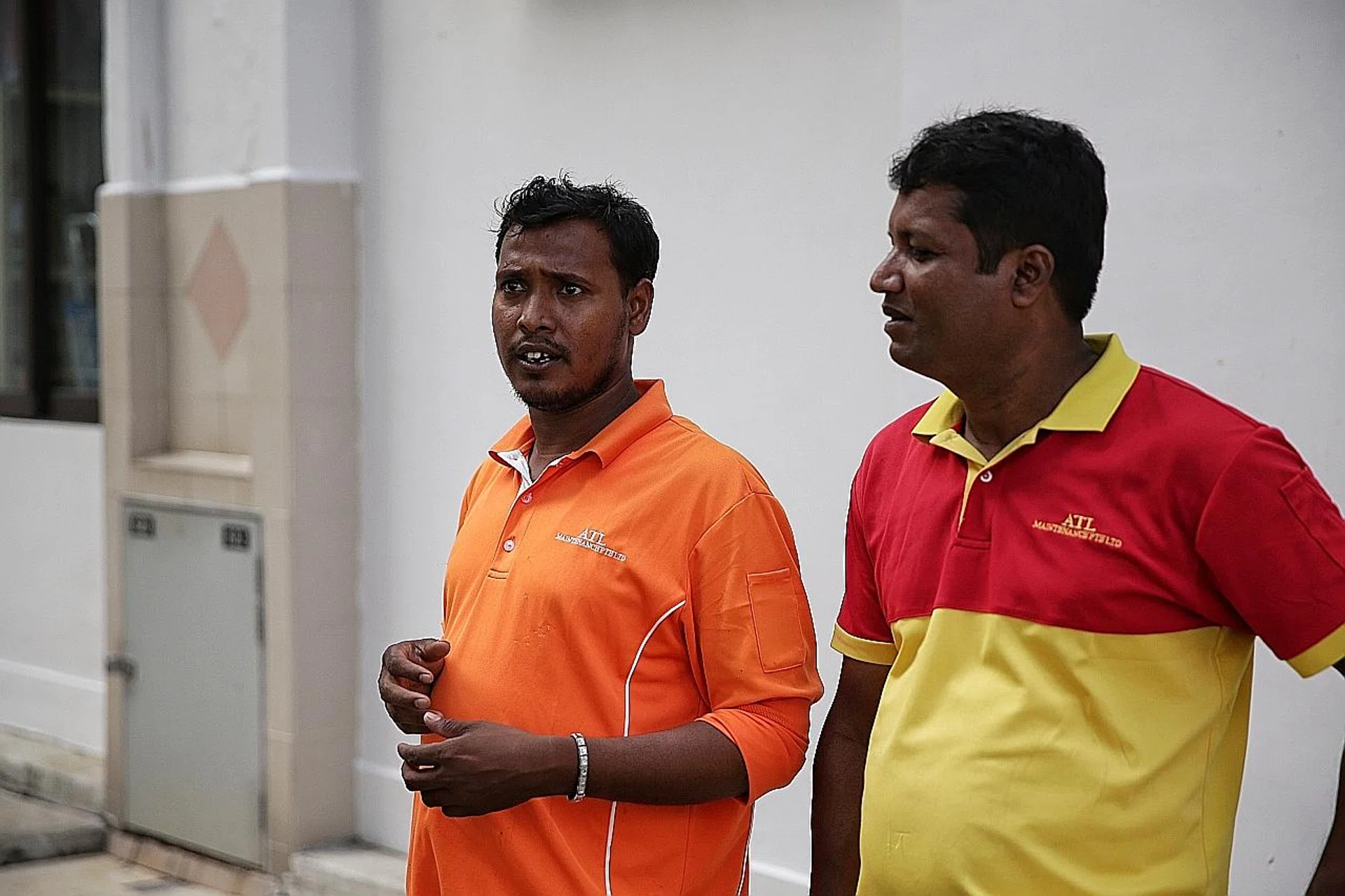 Bangladeshi cleaners Patwari Shamim (left) and Mostafa Kamal found the baby in a bin in Bedok North. 