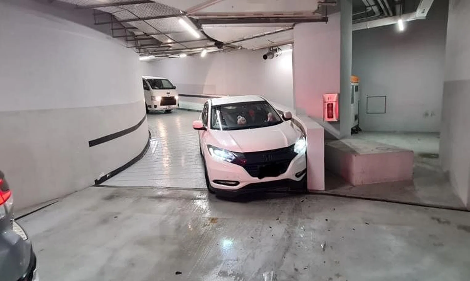 Several cars were damaged after sliding down the curved ramp.